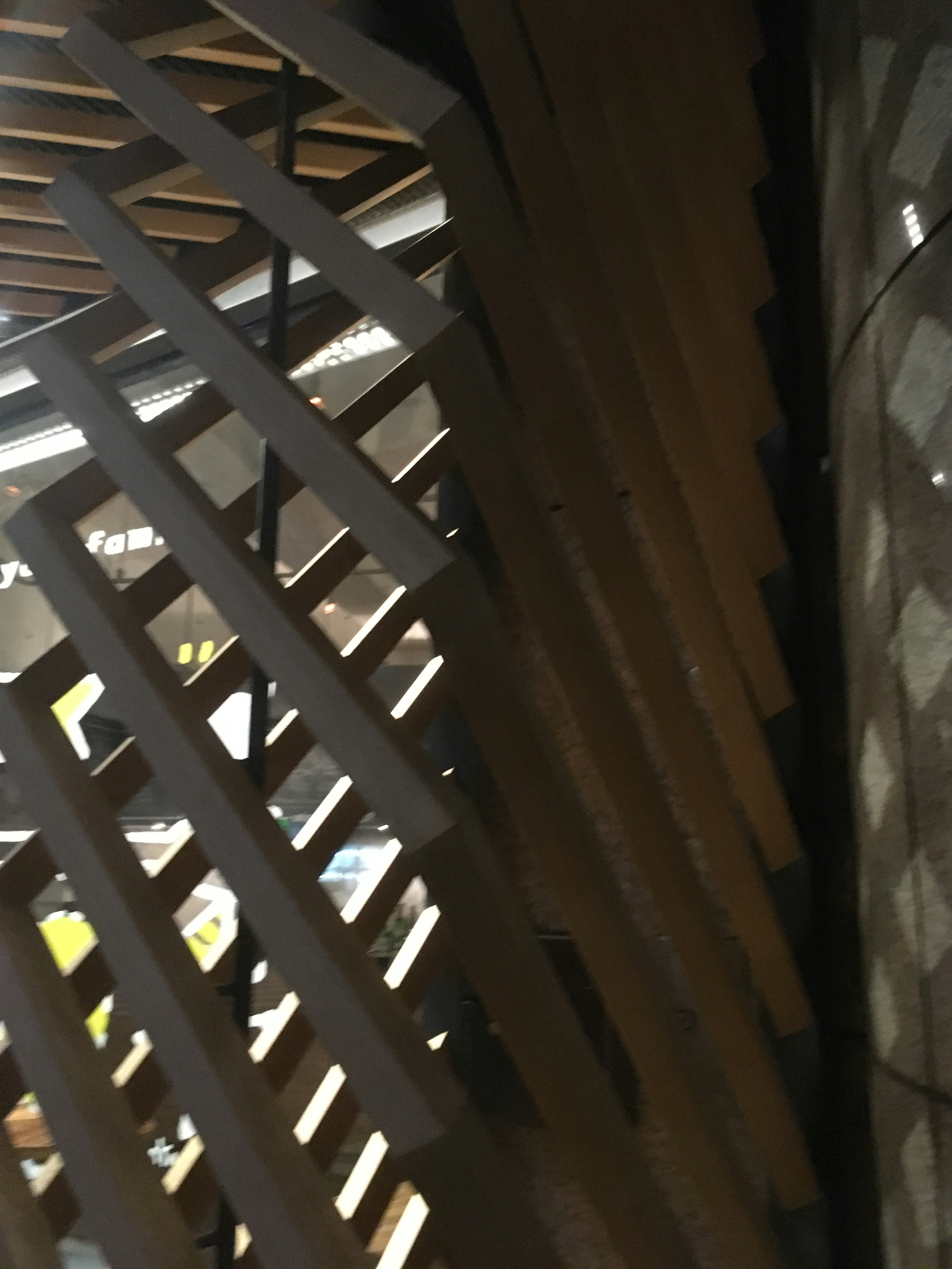 Part of a structure featuring diagonal wooden slats