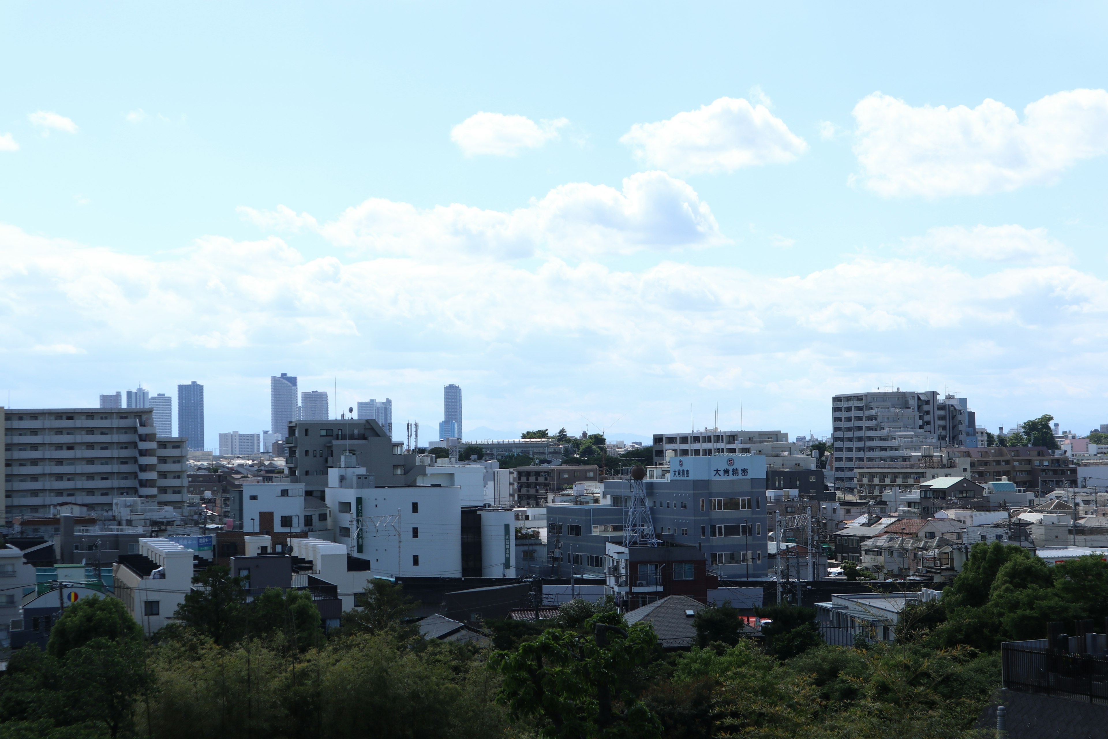 Urban landscape with high-rise buildings under a blue sky