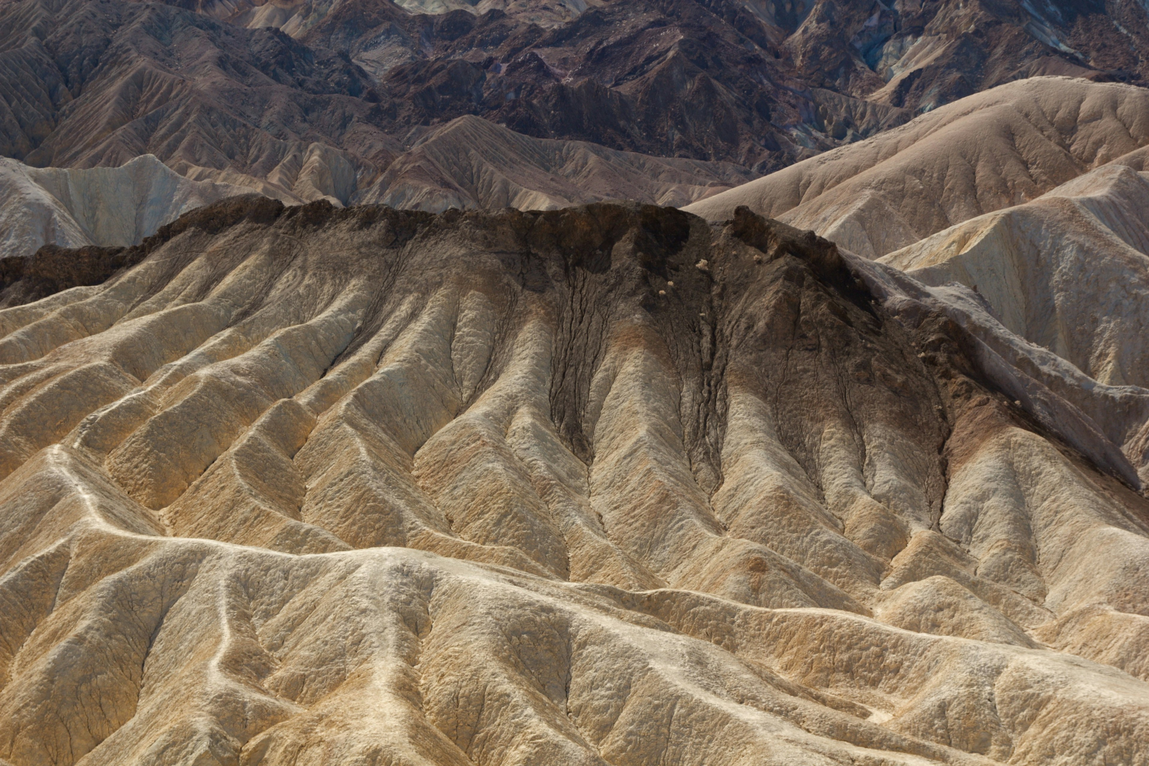 Undulating brown mountain ranges with dry terrain