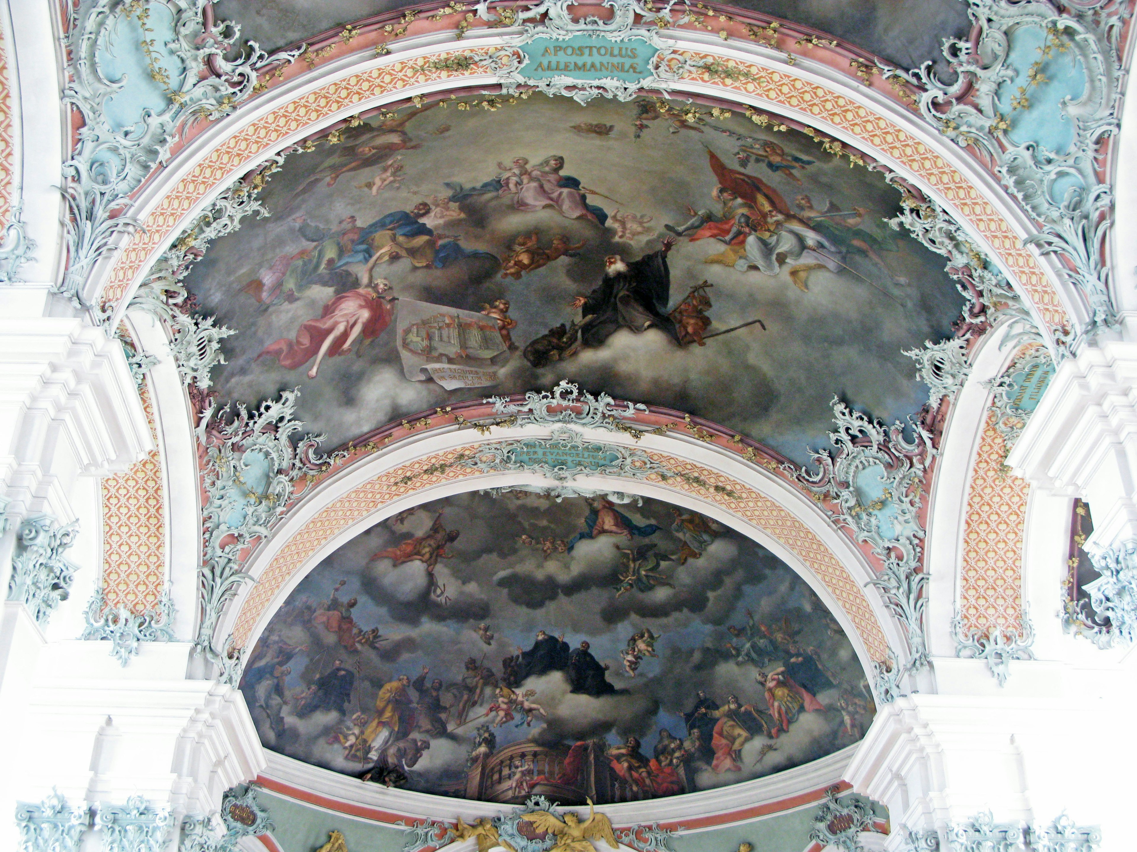 Interior of a historic building featuring a beautifully decorated ceiling mural