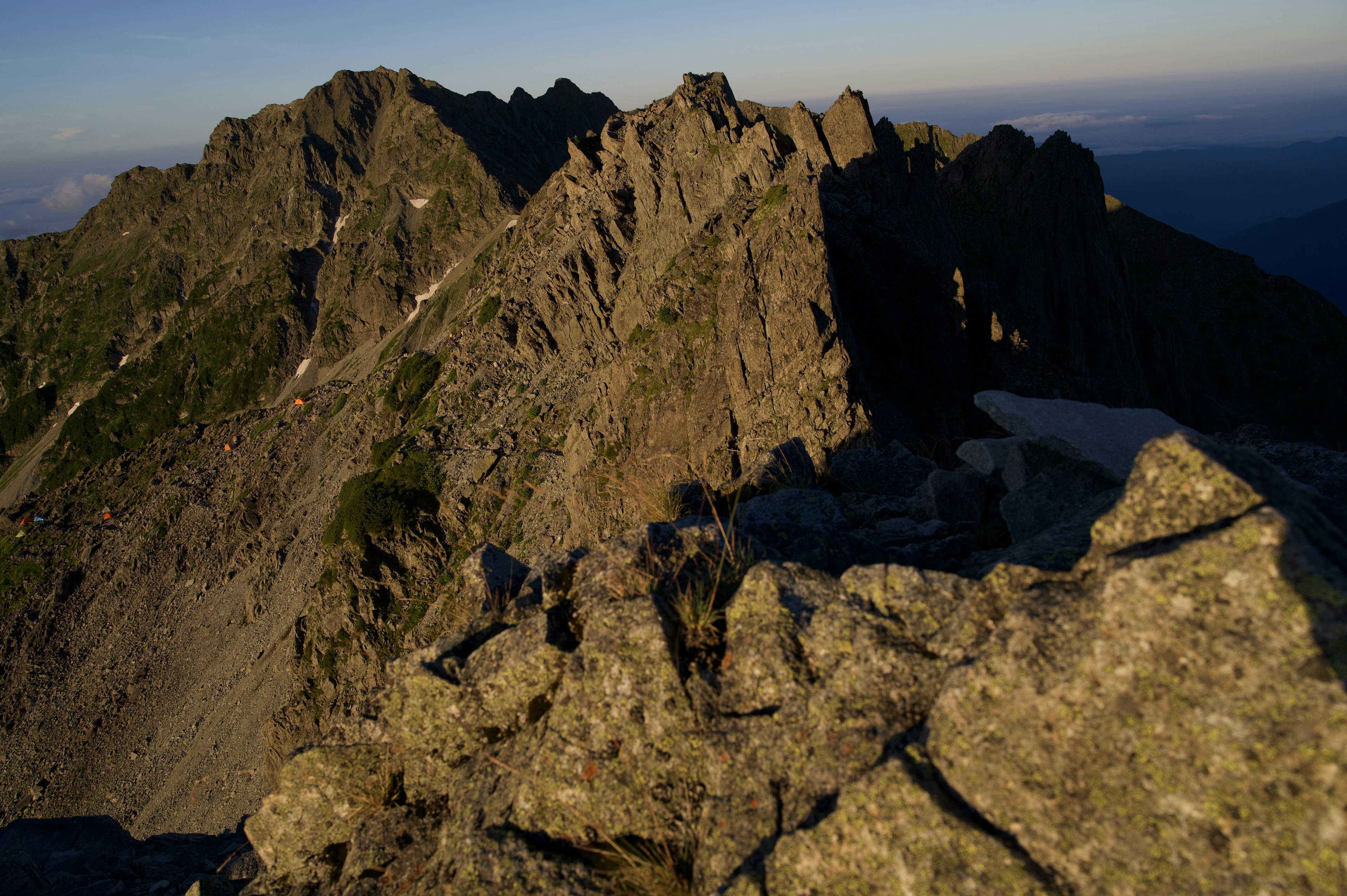 Jagged mountain peak illuminated by sunset