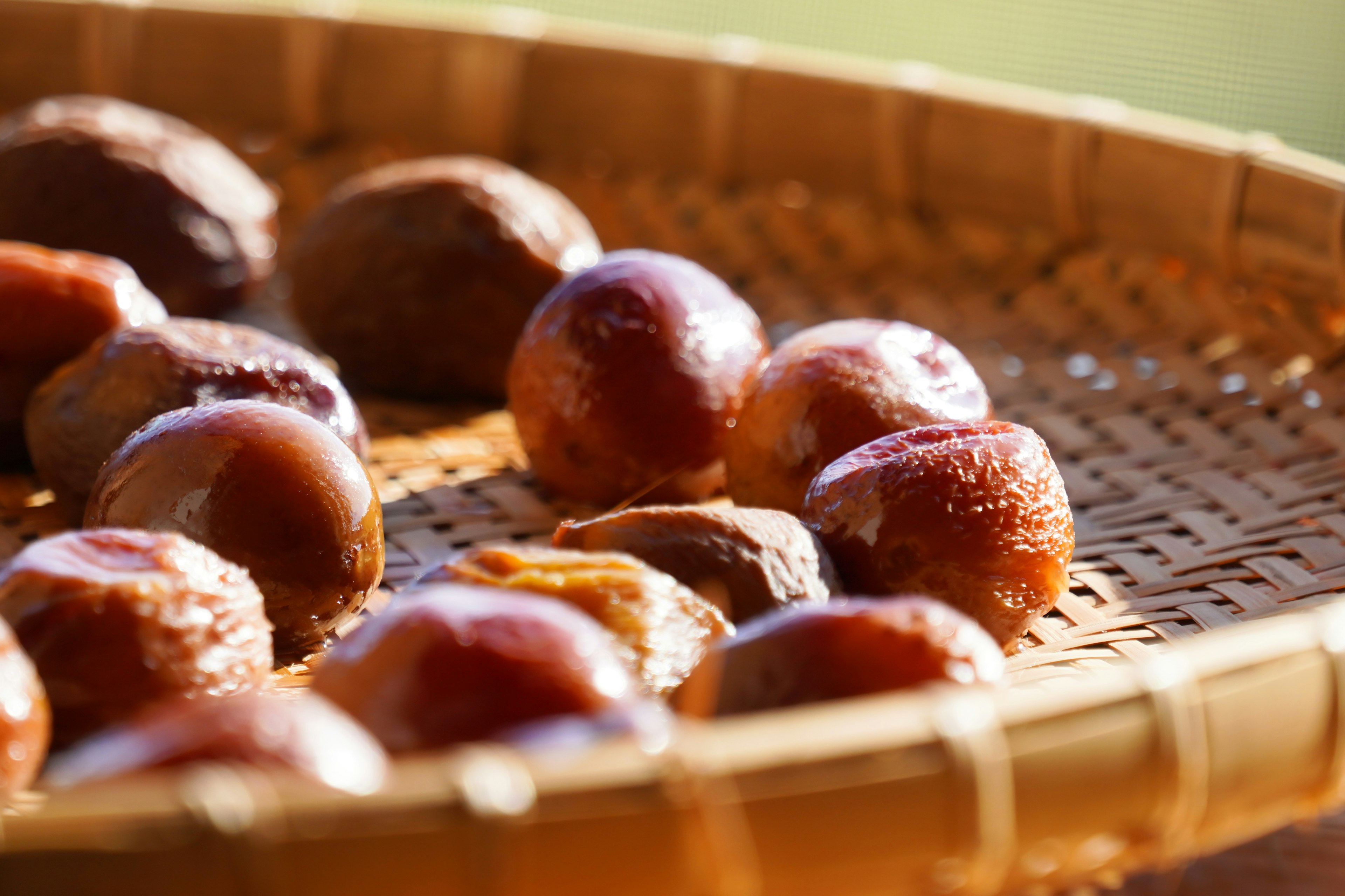 Close-up of sweet chestnuts in a woven basket