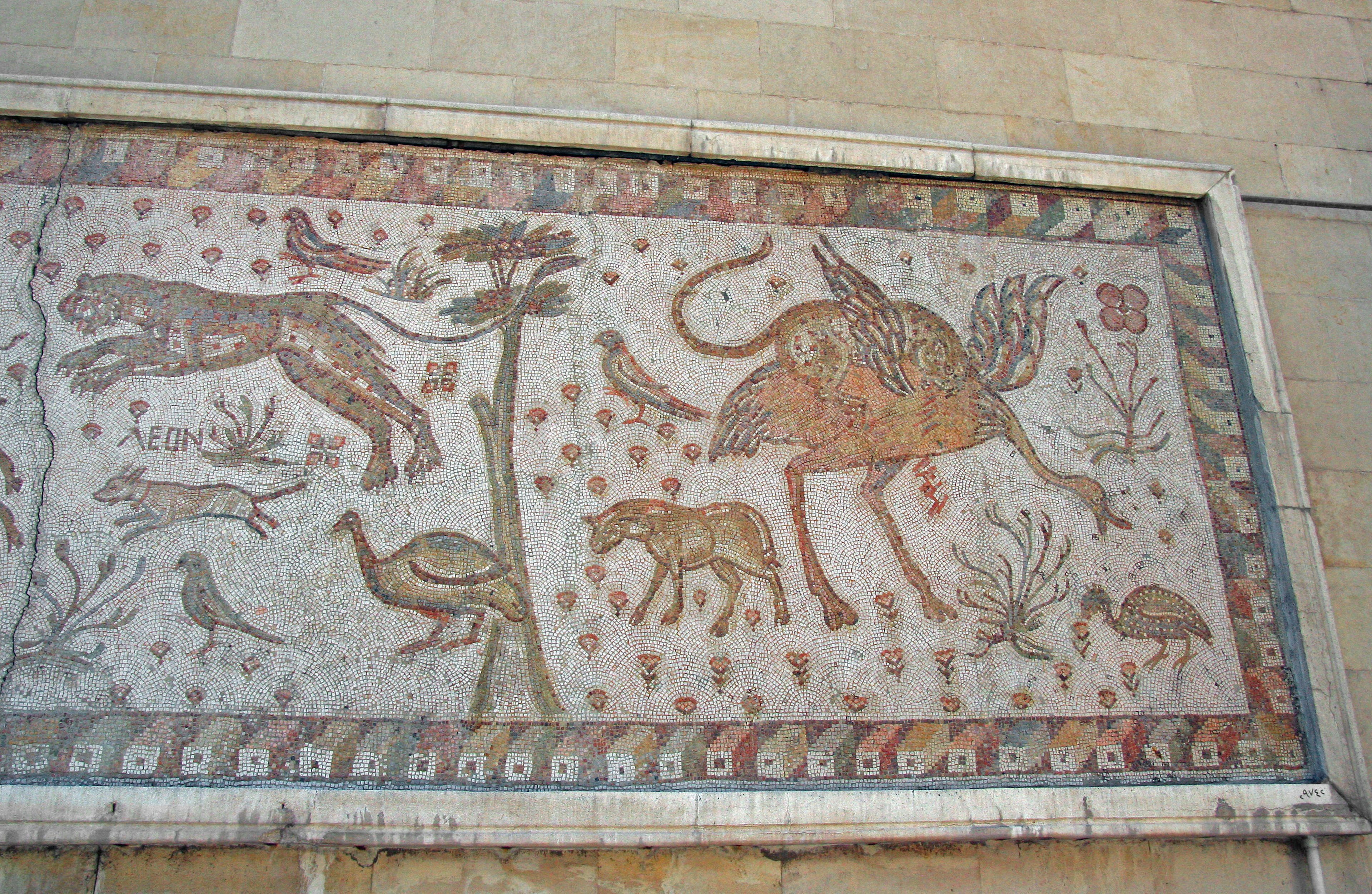 Ancient mosaic artwork depicting animals and plant designs