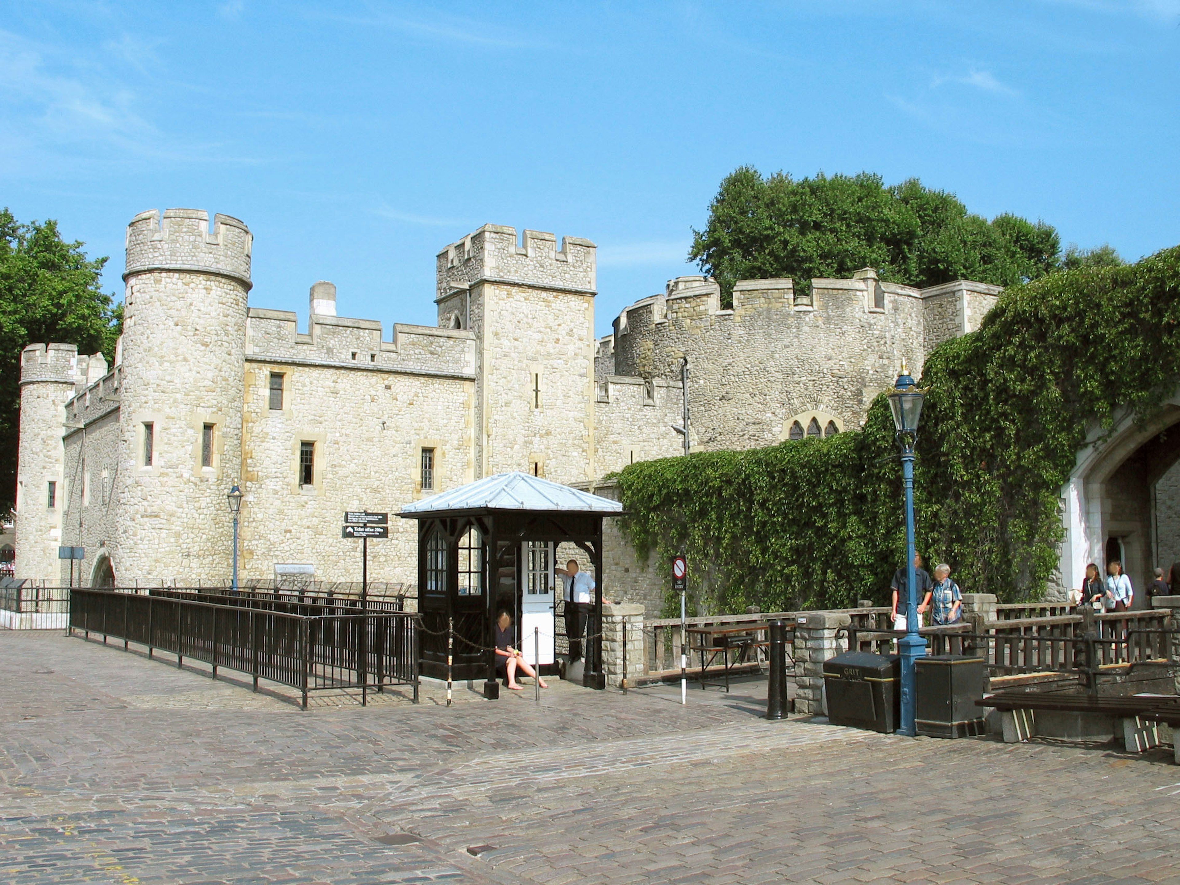 Medieval castle with stone walls and towers against a blue sky