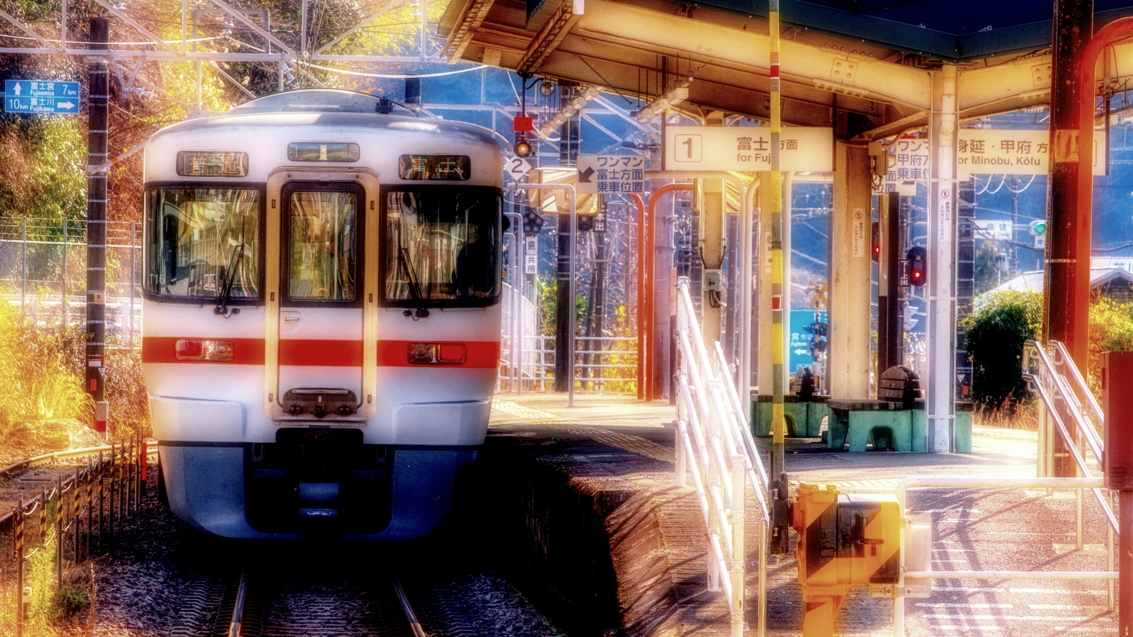 Train at a station with vibrant surroundings