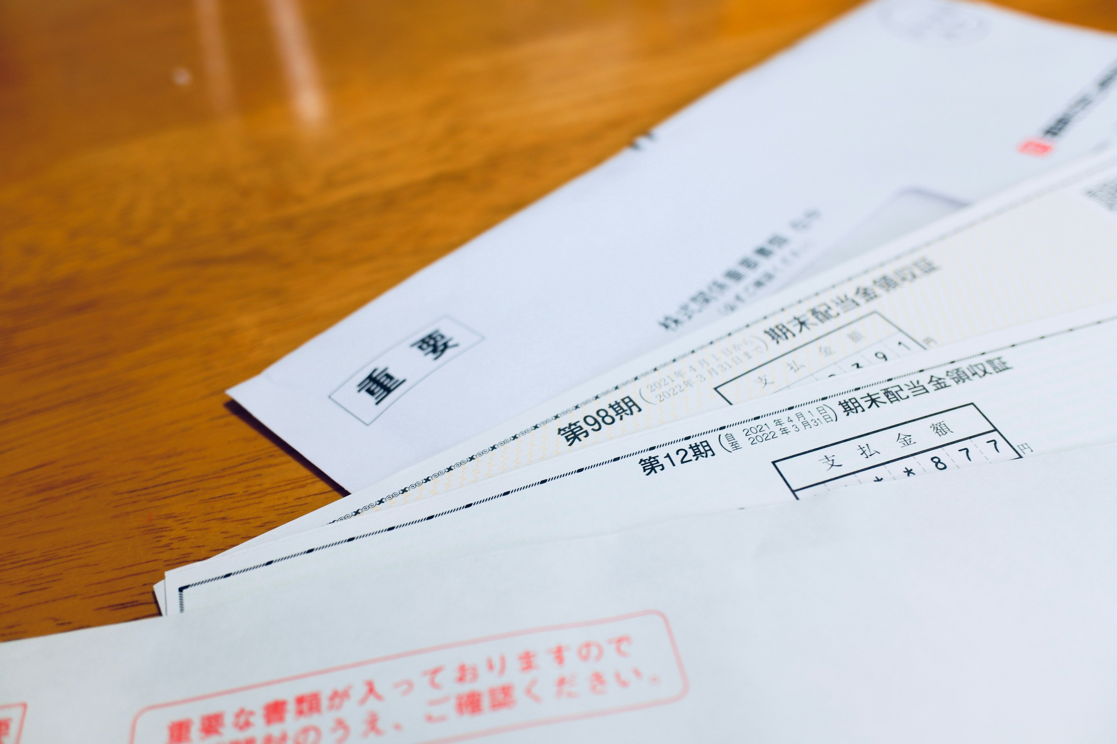 Set of Japanese envelopes and documents on a wooden table