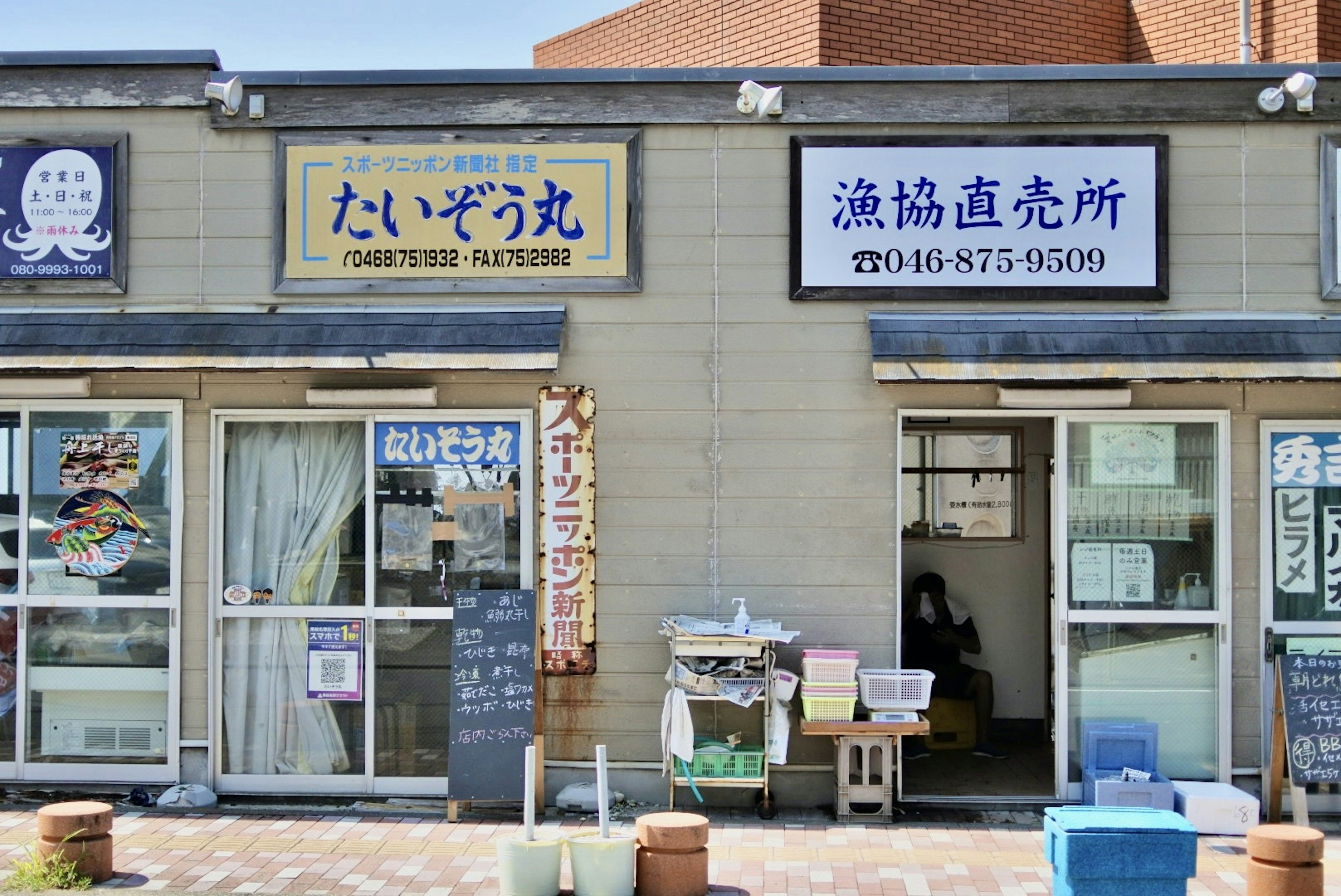 Exterior view of seafood market and restaurant signs