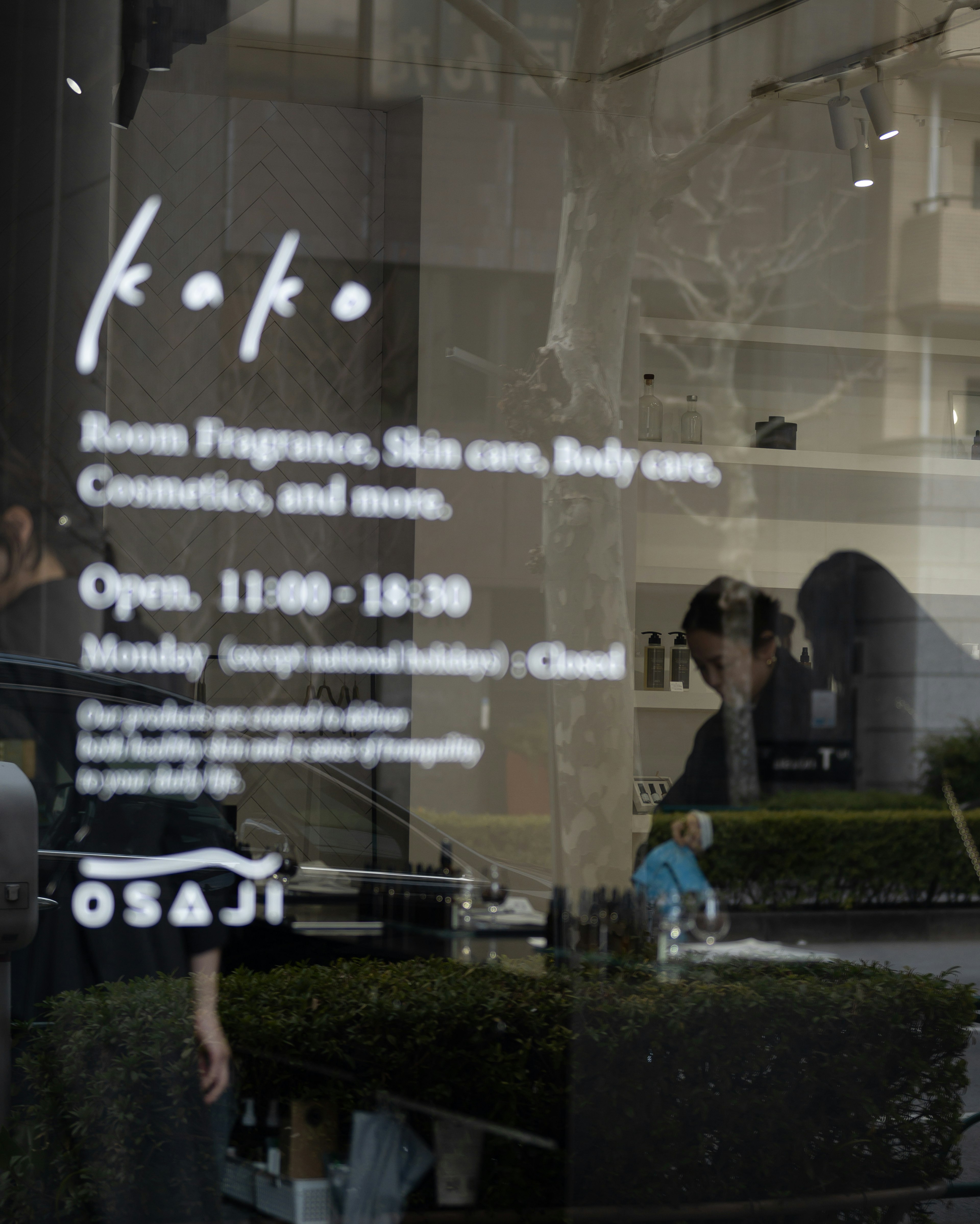 koto store window displaying hours and product information