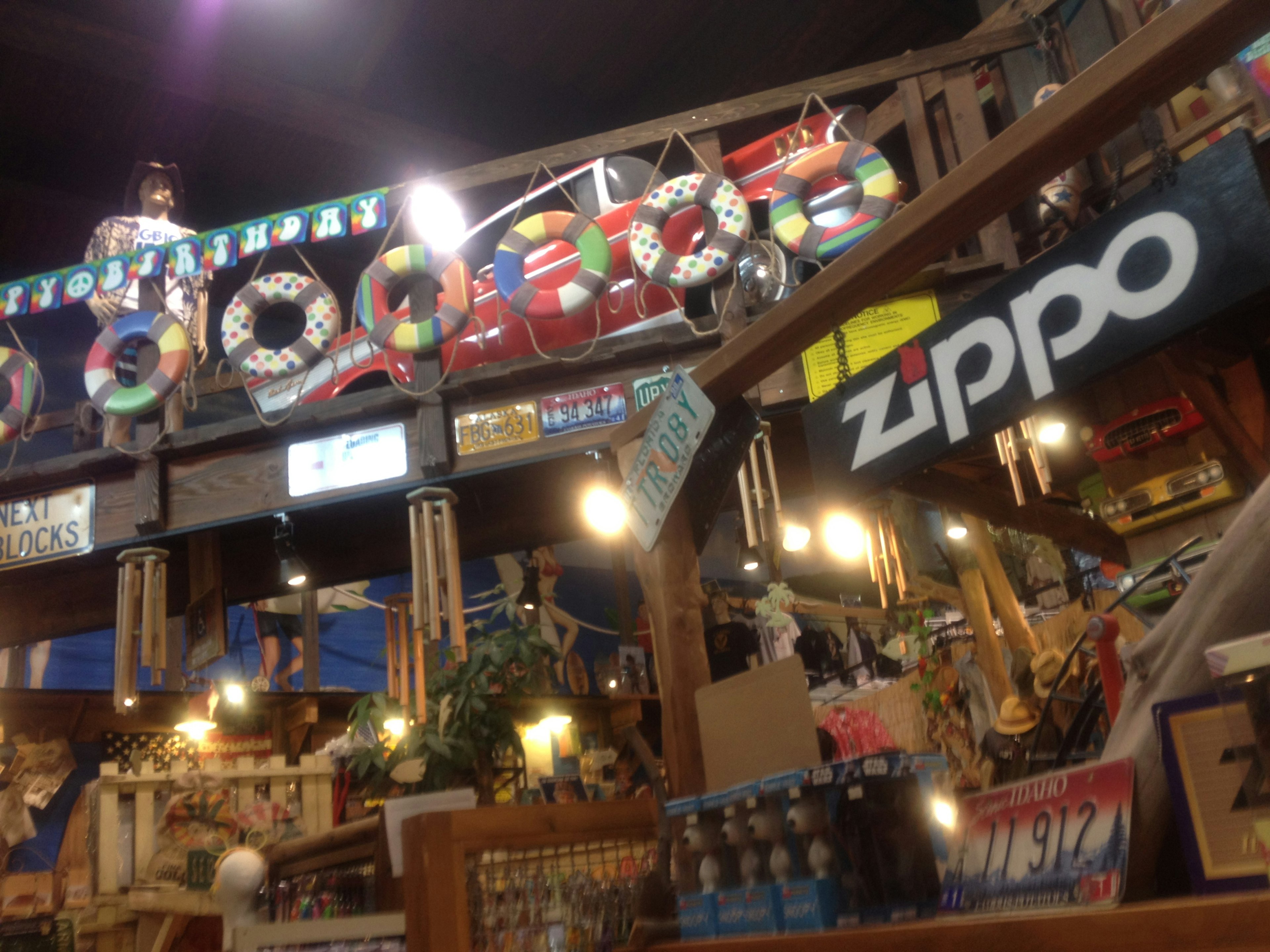 Vibrant interior featuring colorful life buoys and a Zippo sign overhead