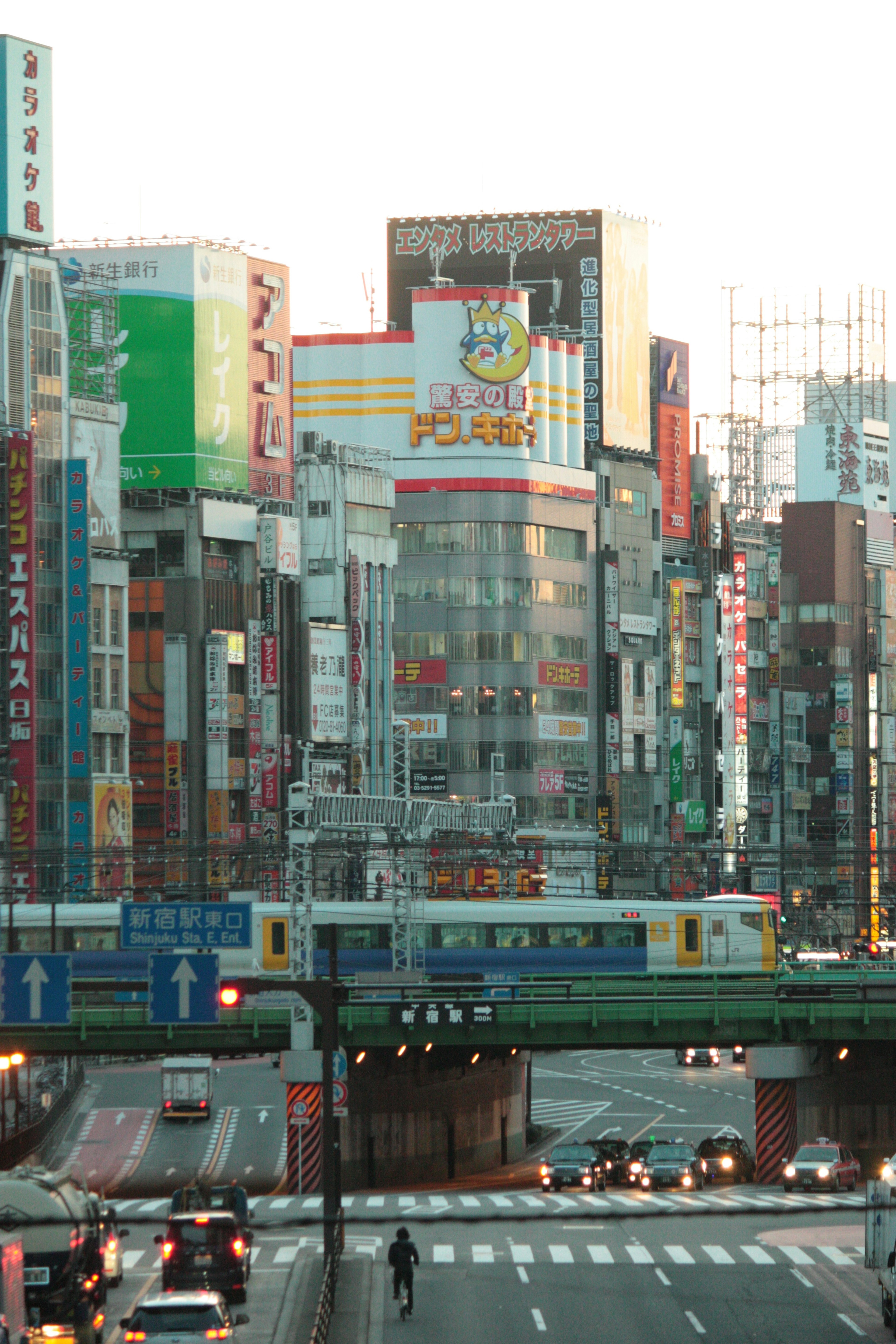 Urban skyline featuring colorful buildings and a train