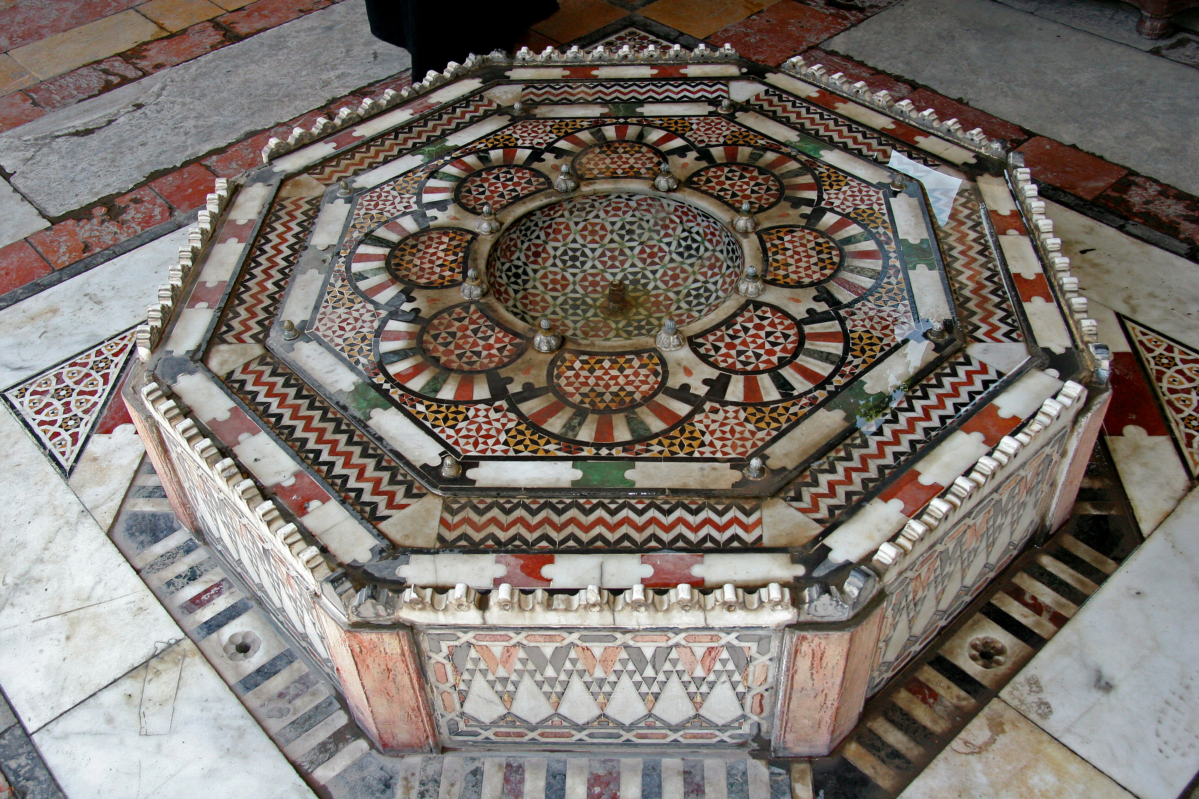 Decorative octagonal table featuring intricate mosaic patterns