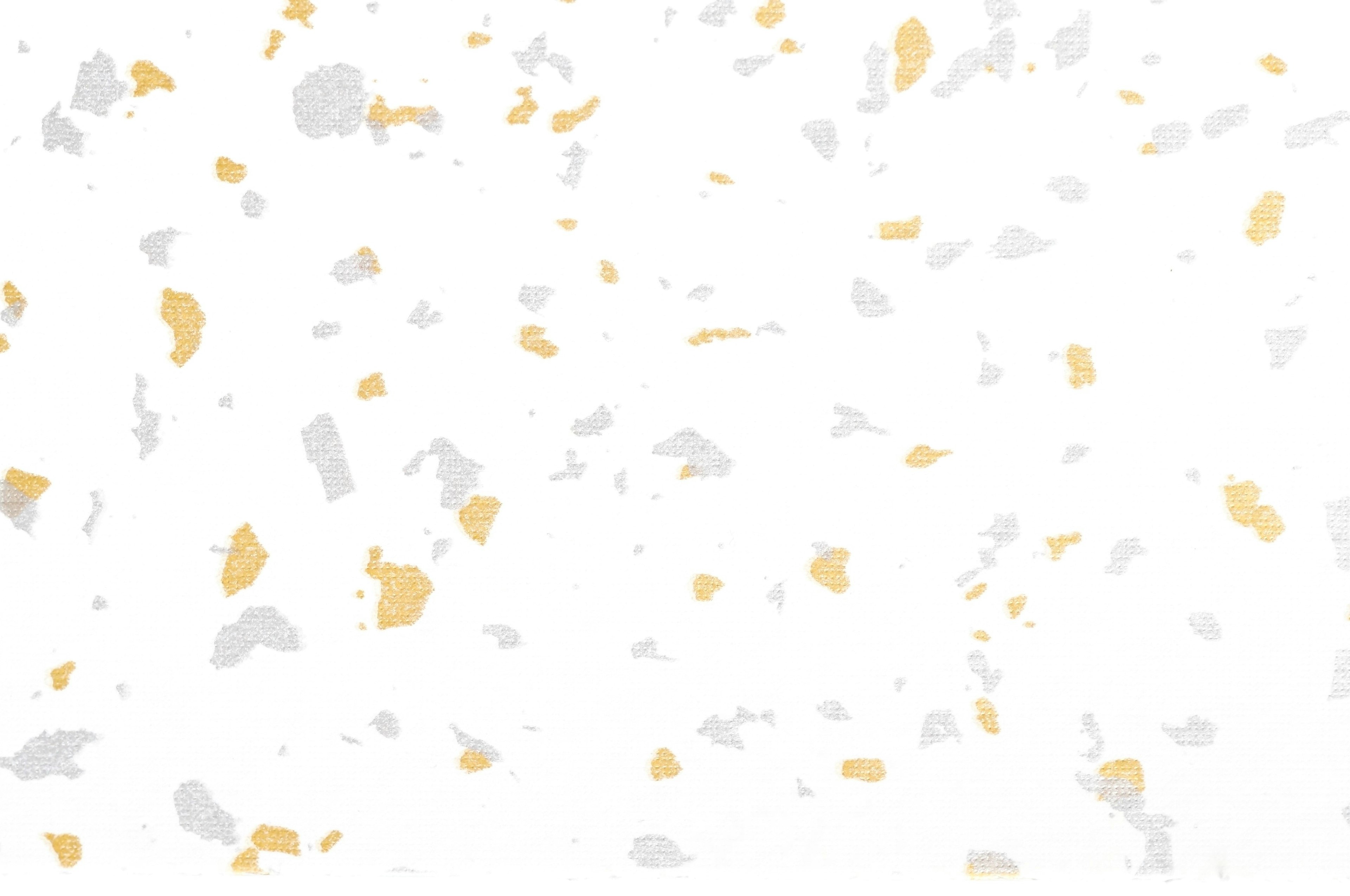 Texturierten Hintergrund mit verstreuten goldenen und silbernen Spritzern auf einer weißen Oberfläche