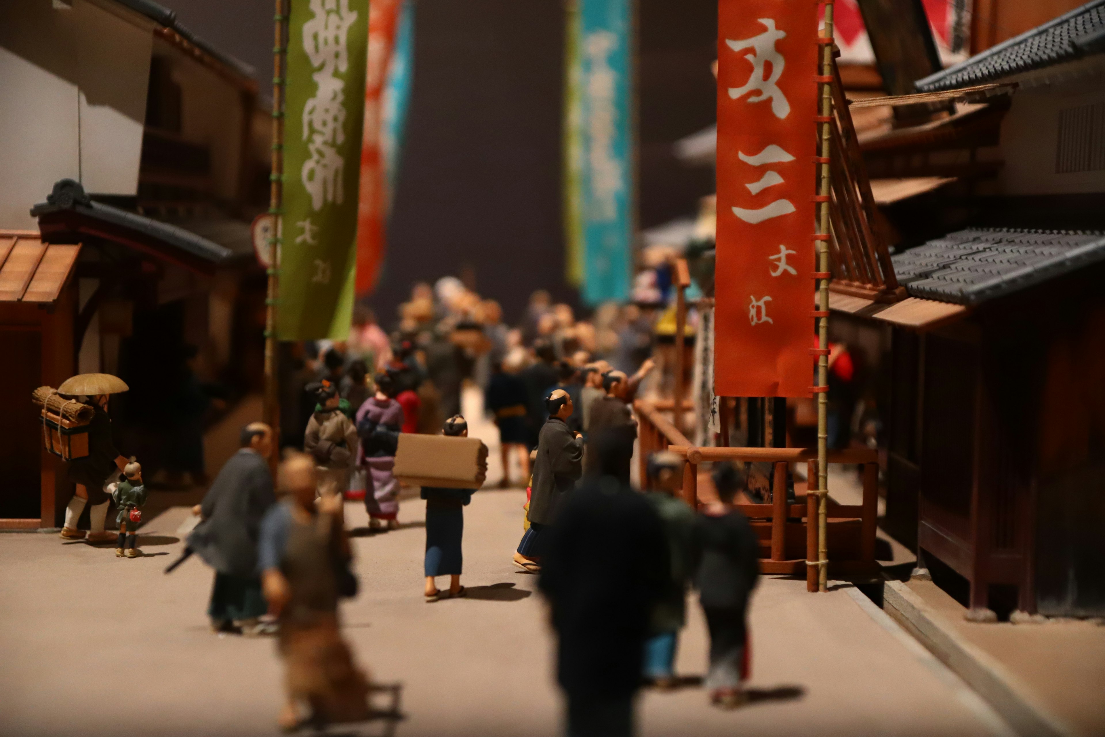 Miniature town scene with people gathered in a street