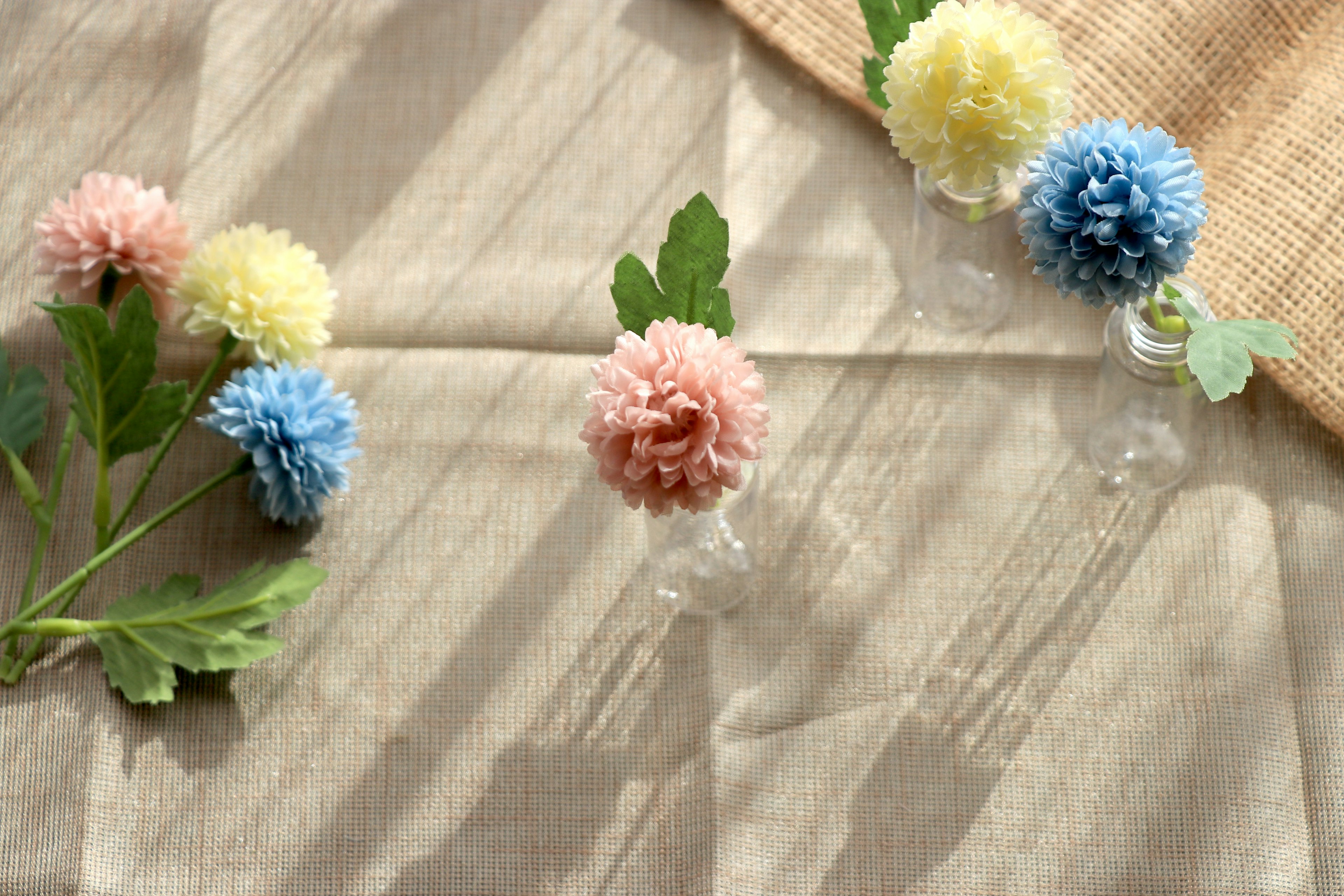 Colorful flowers and leaves arranged on a tabletop