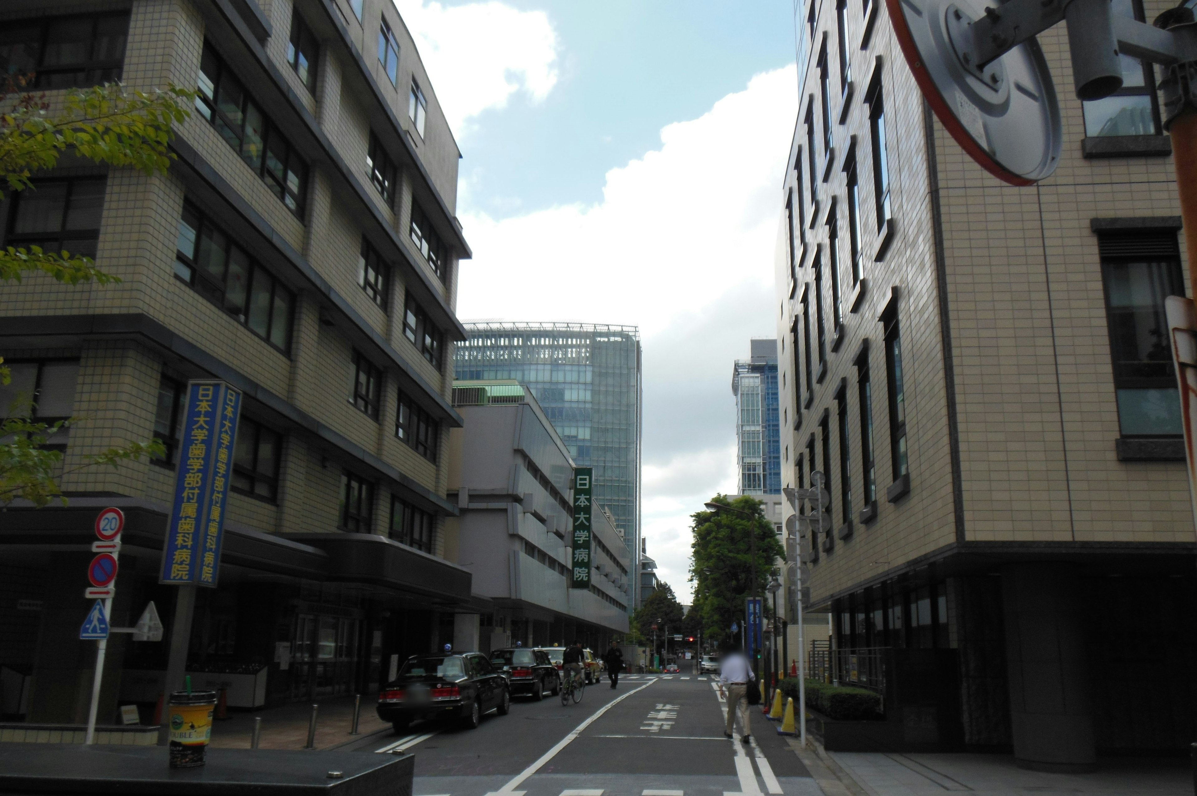 Urban street scene with modern buildings and blue sky