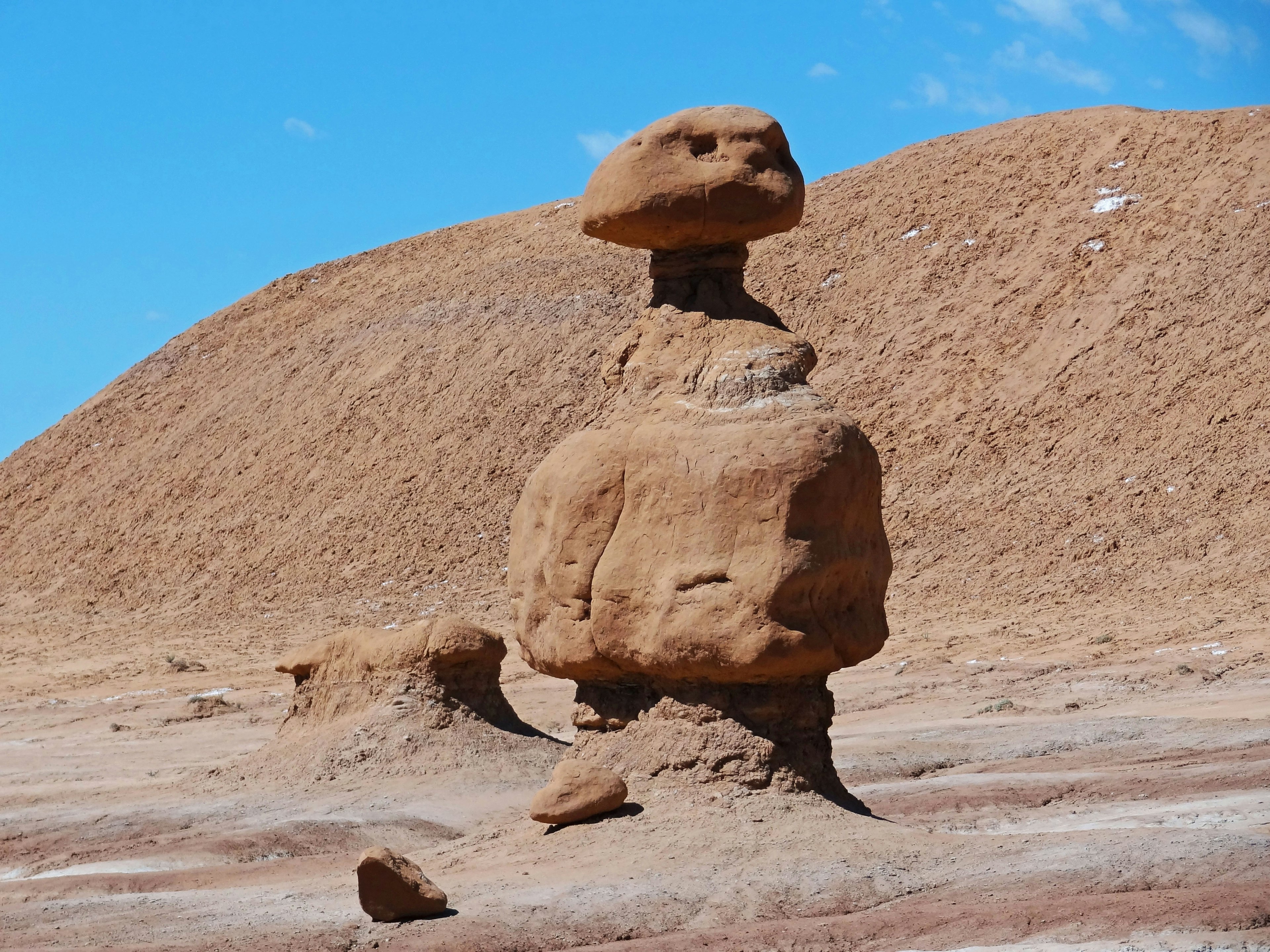 A unique weathered rock formation in a desert landscape