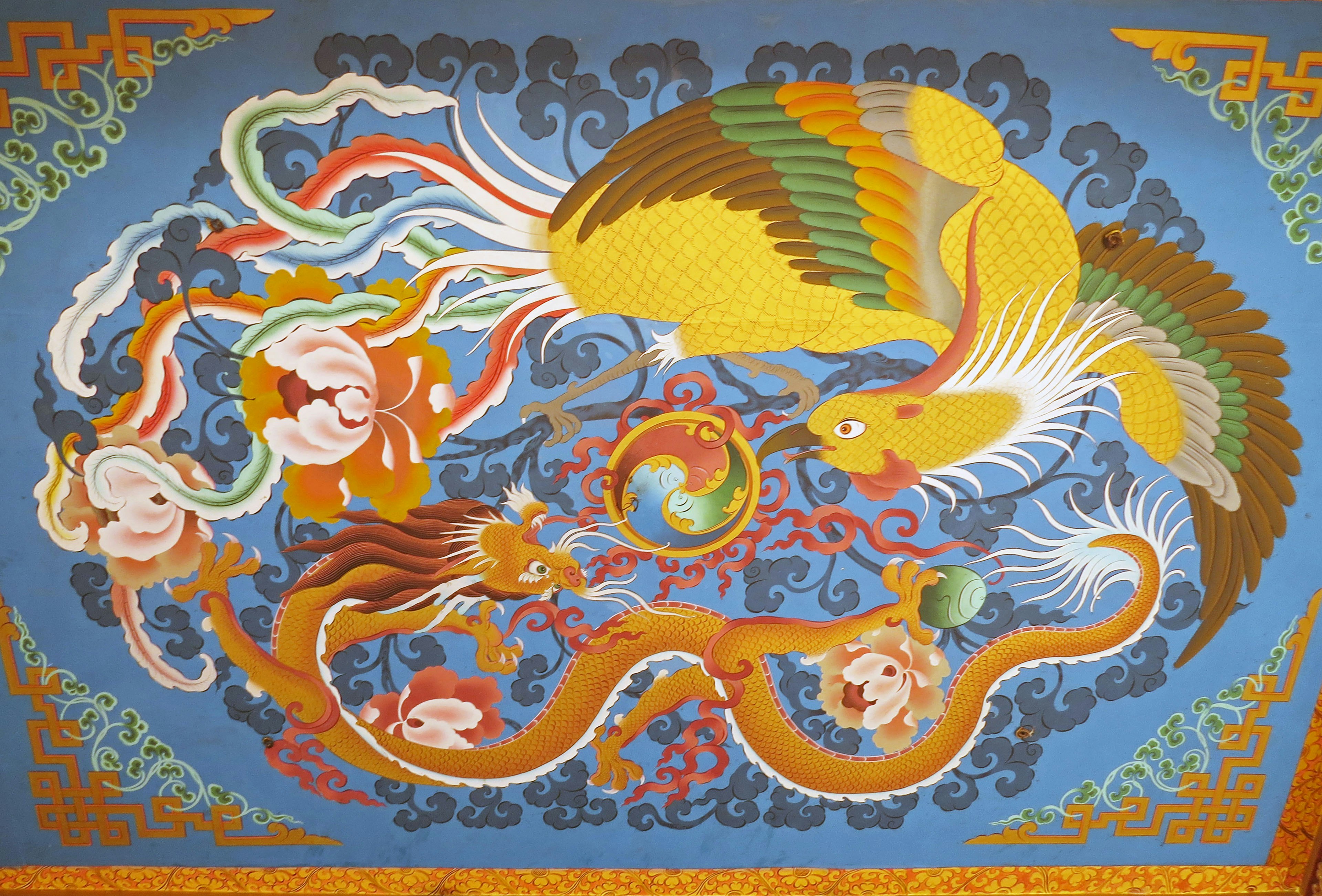 Colorful dragon and phoenix depicted in traditional artwork