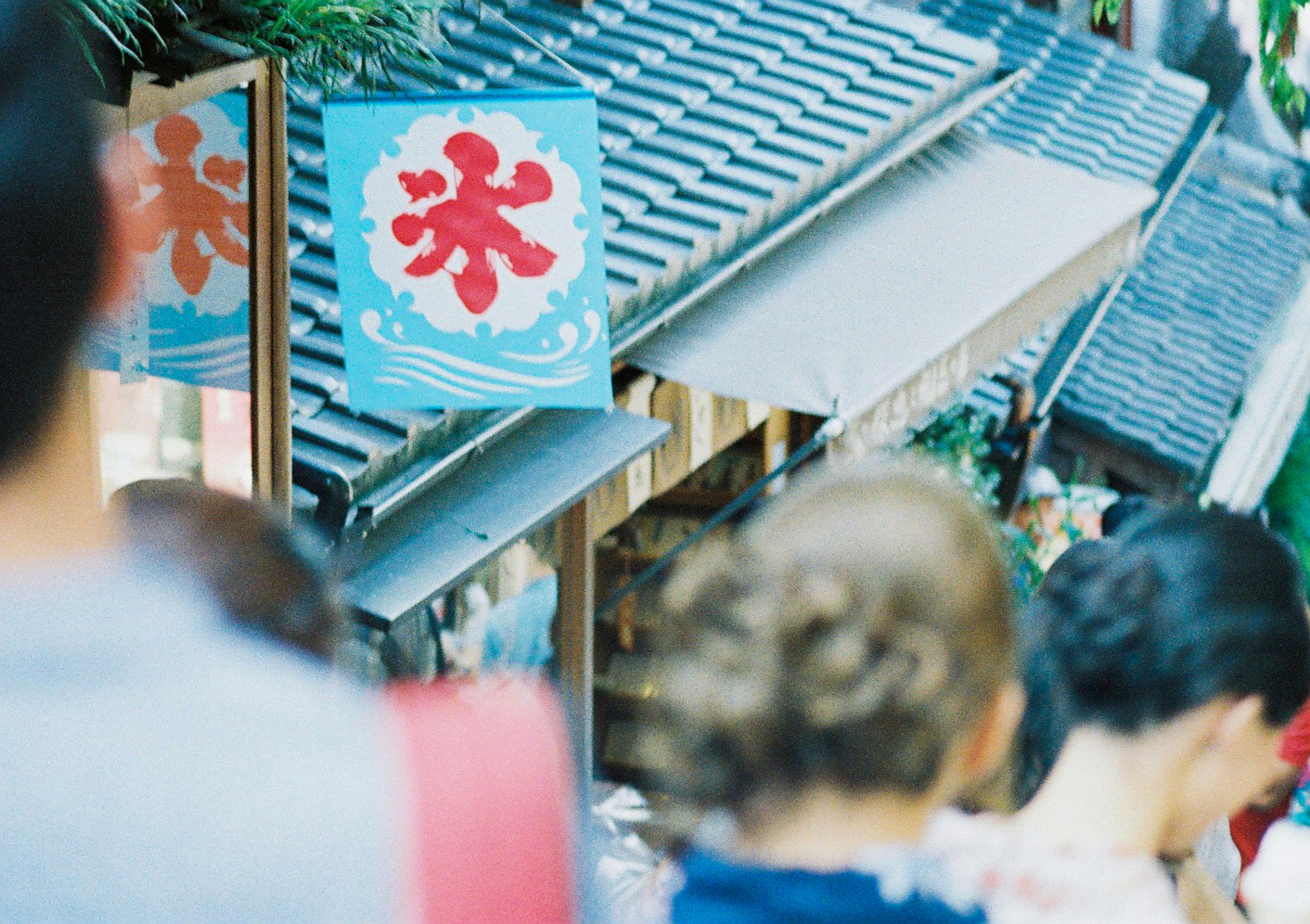 Crowd in front of a stall with an ice sign