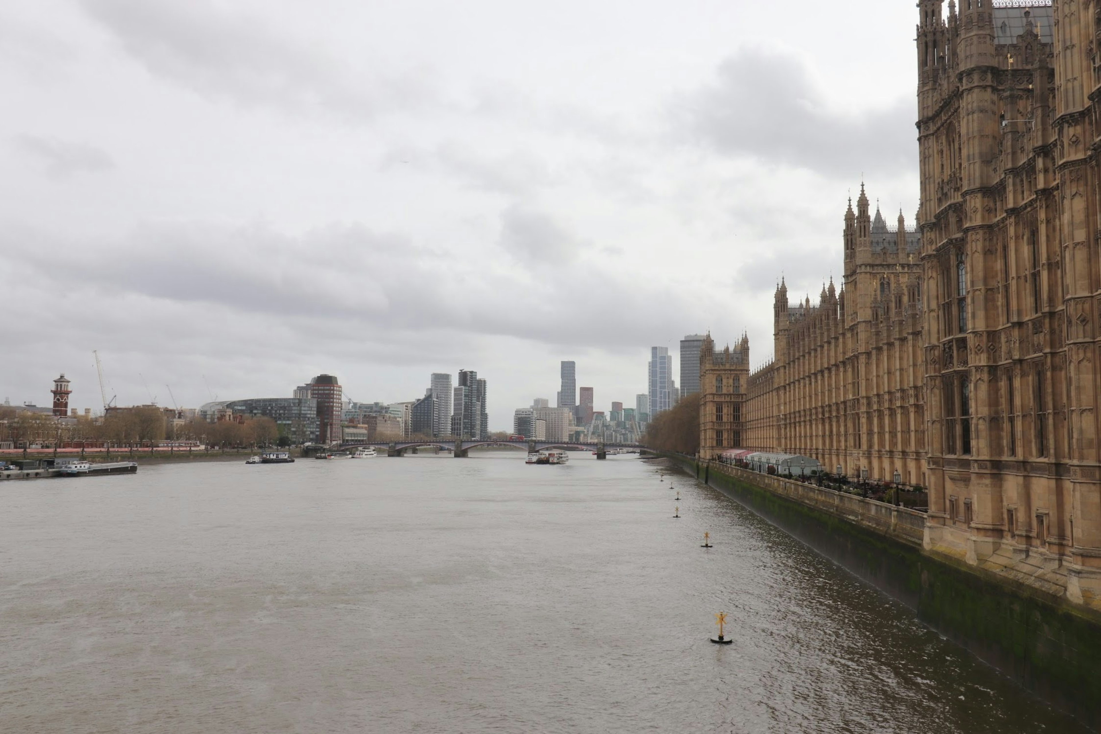 View of the River Thames with the skyline of London in the background featuring the Palace of Westminster