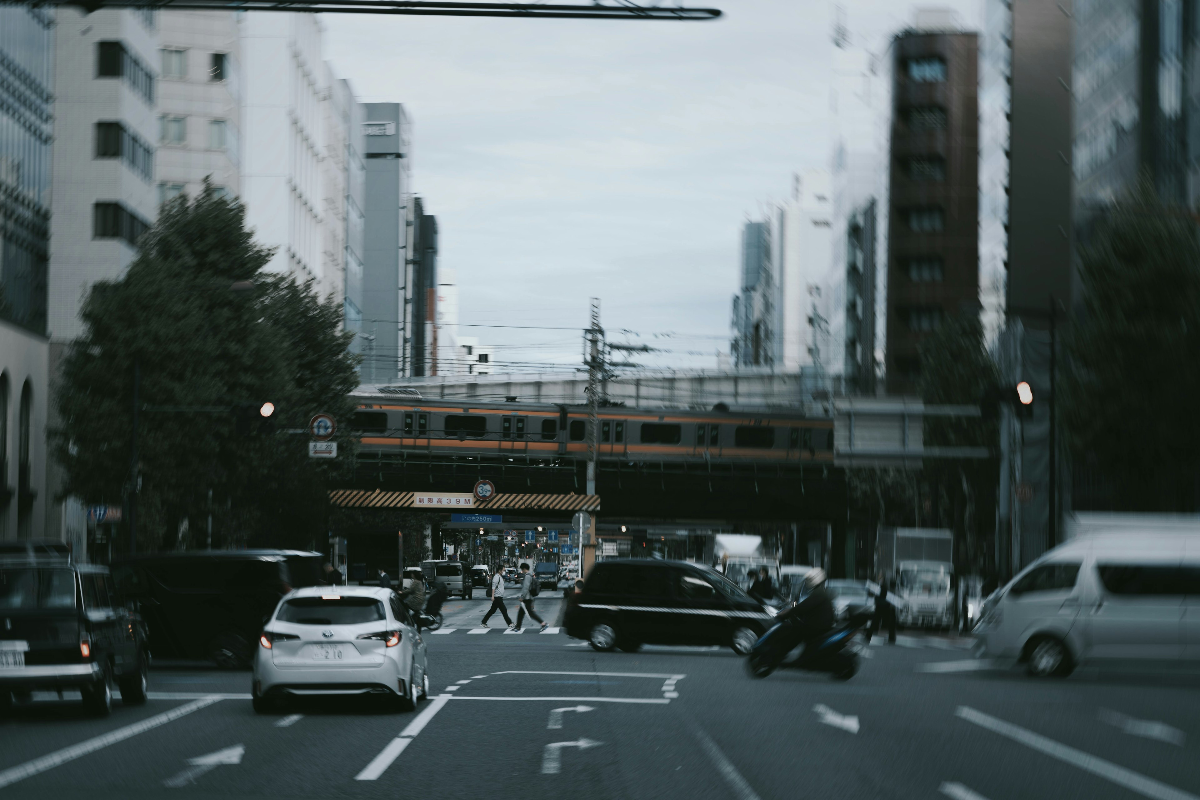 Urban intersection with traffic and train crossing