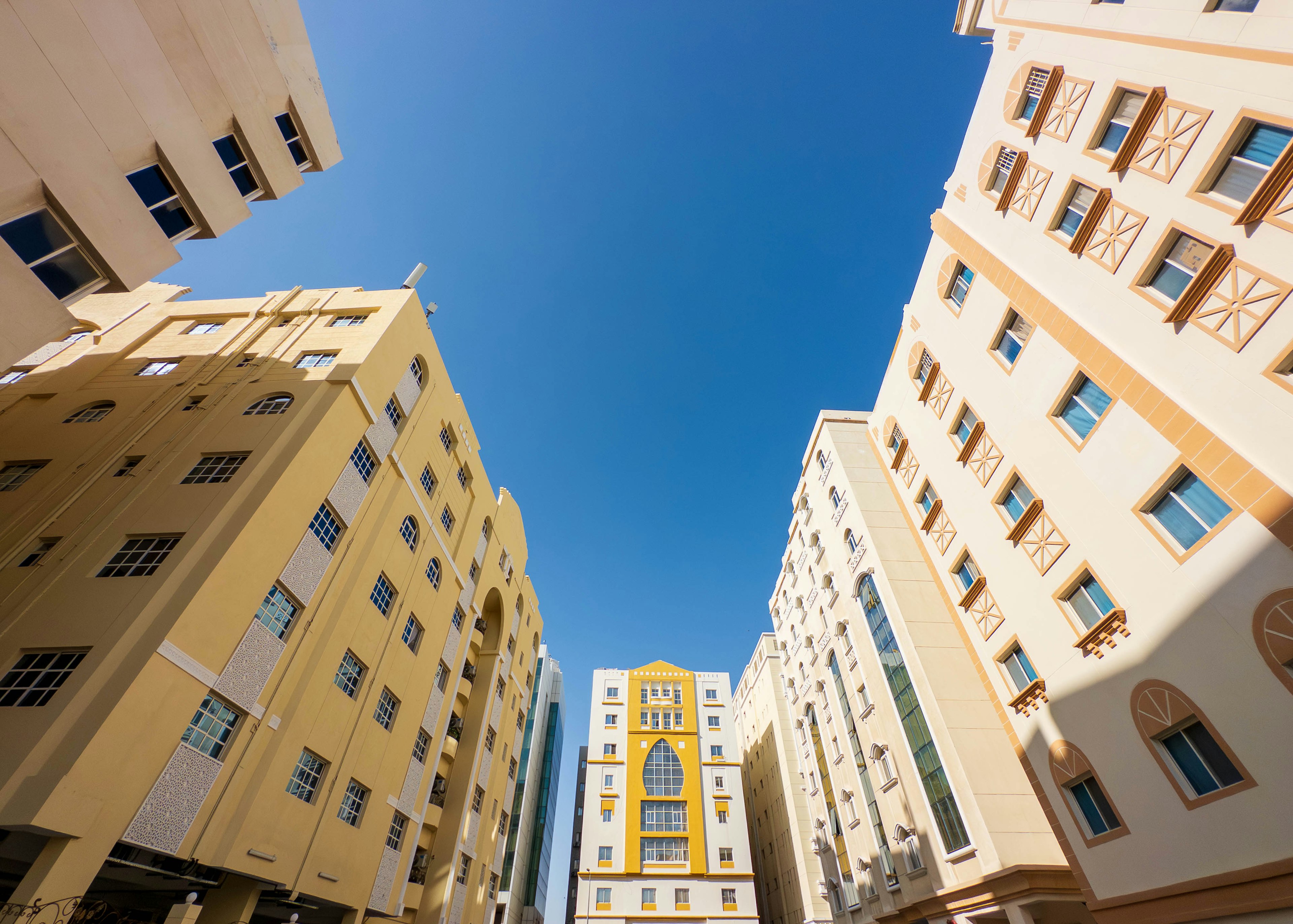 Perspective view of high-rise buildings under a blue sky