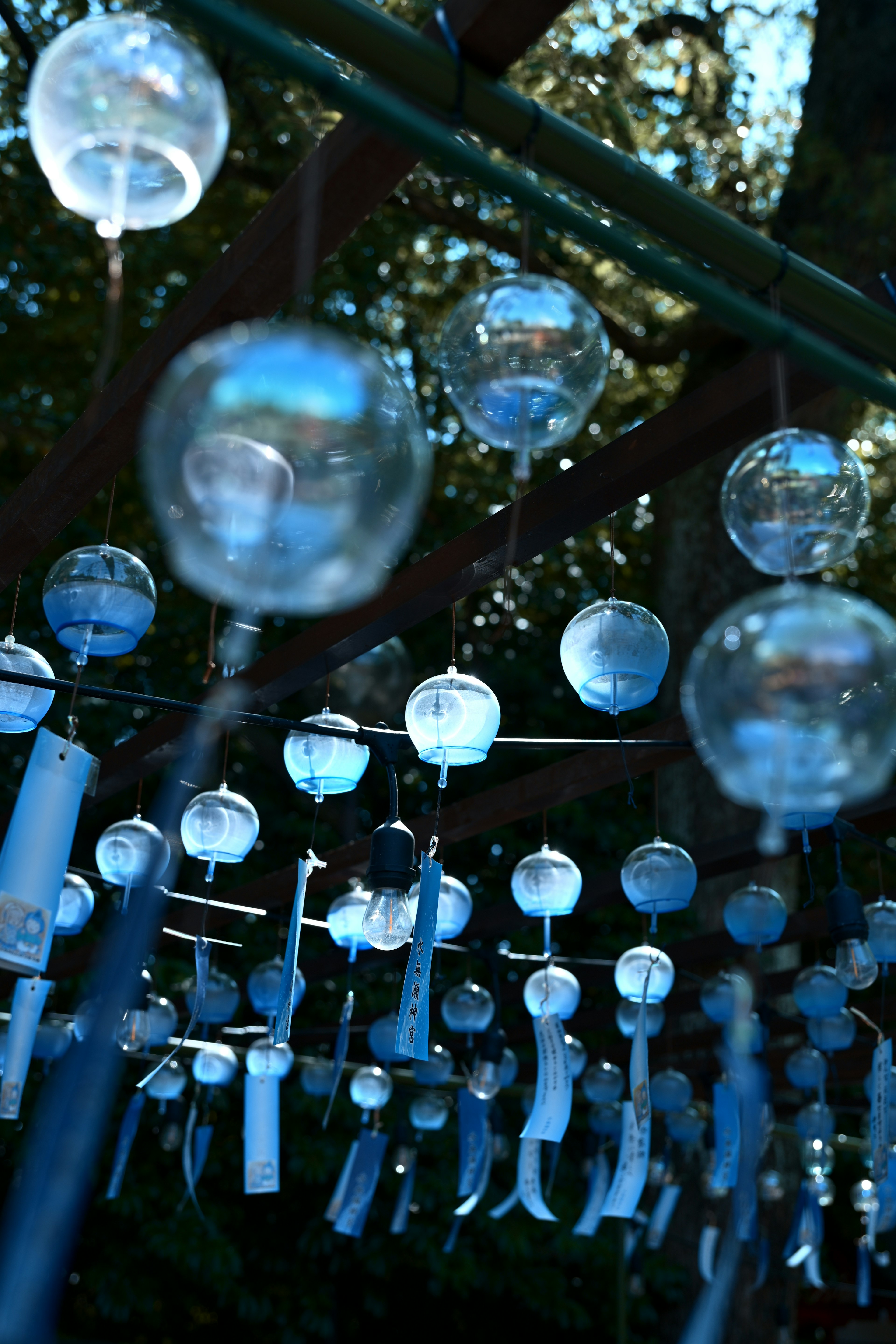 A beautiful scene of blue wind chimes hanging