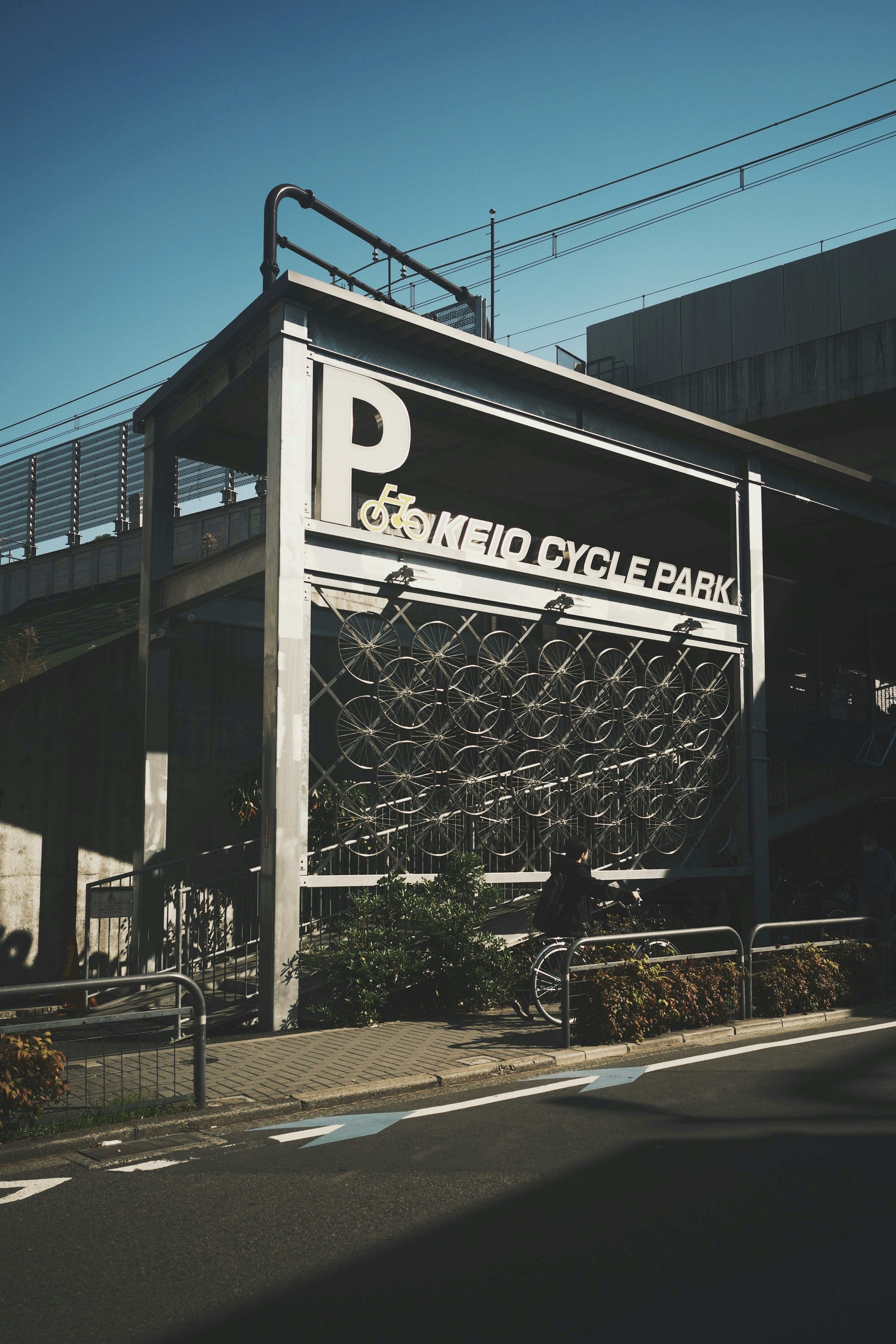 Exterior view of a new cycle park featuring a large P sign