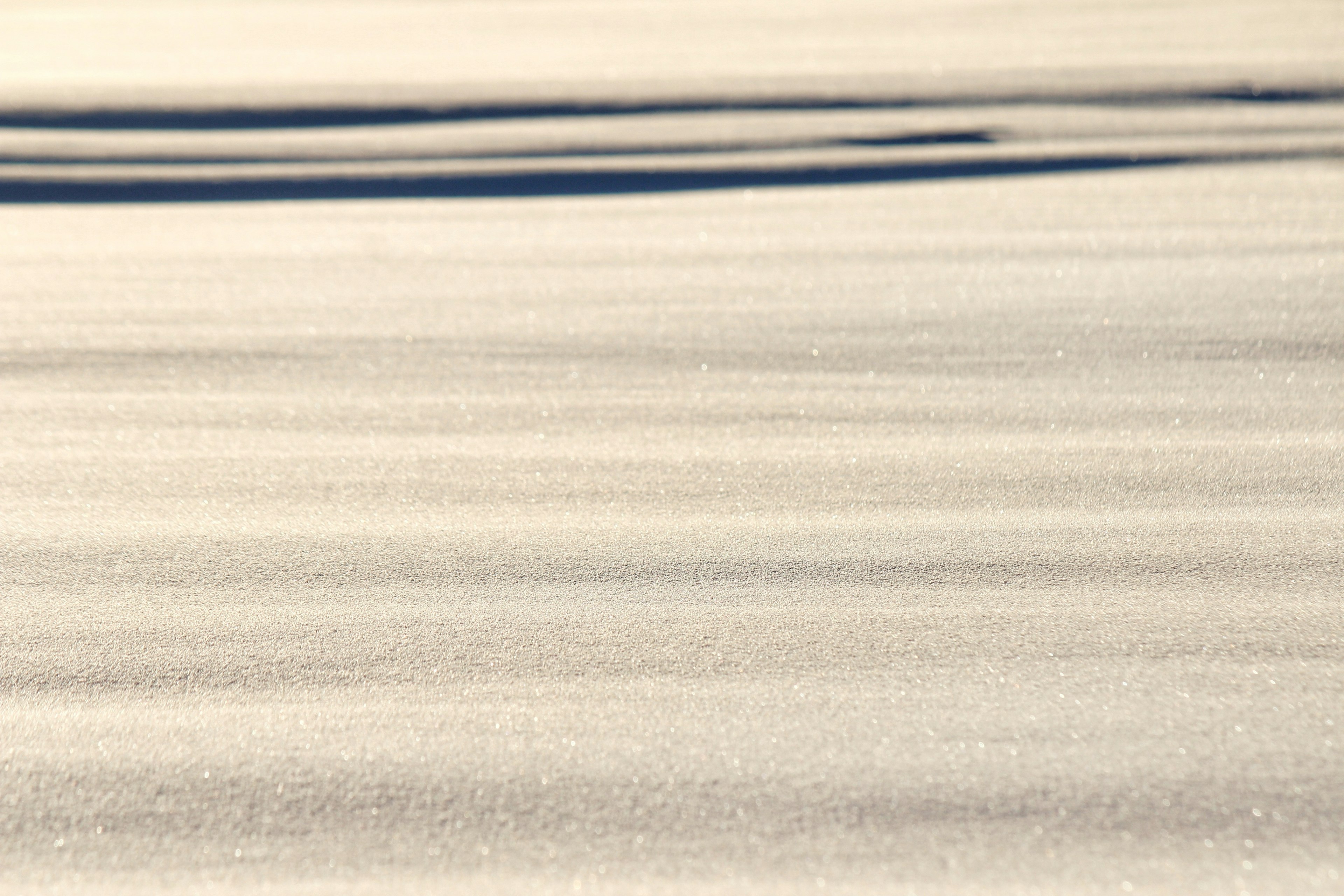 Calm sandy surface with shadow patterns