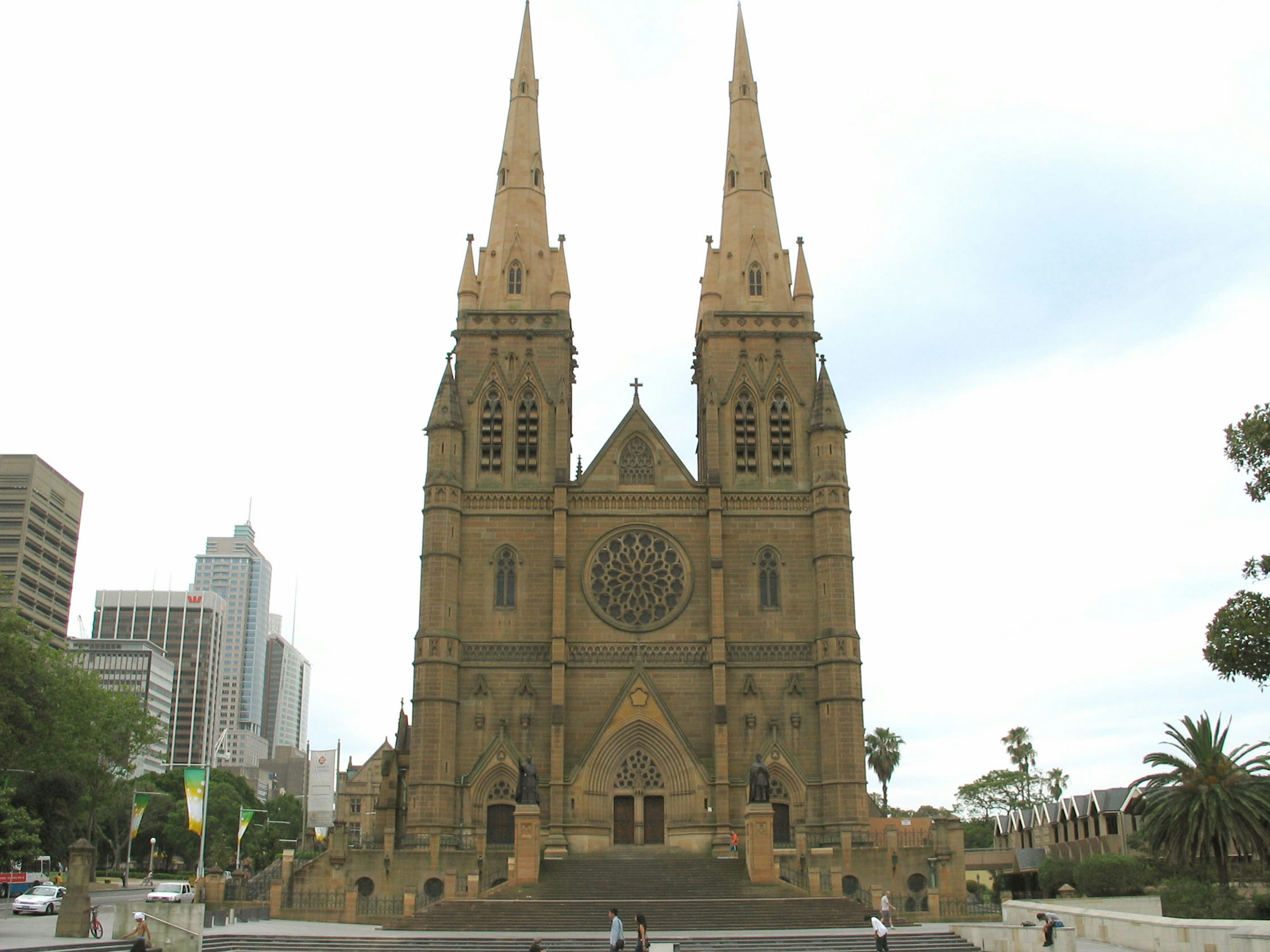 Exterior of St Mary's Cathedral in Sydney featuring twin spires and Gothic architecture