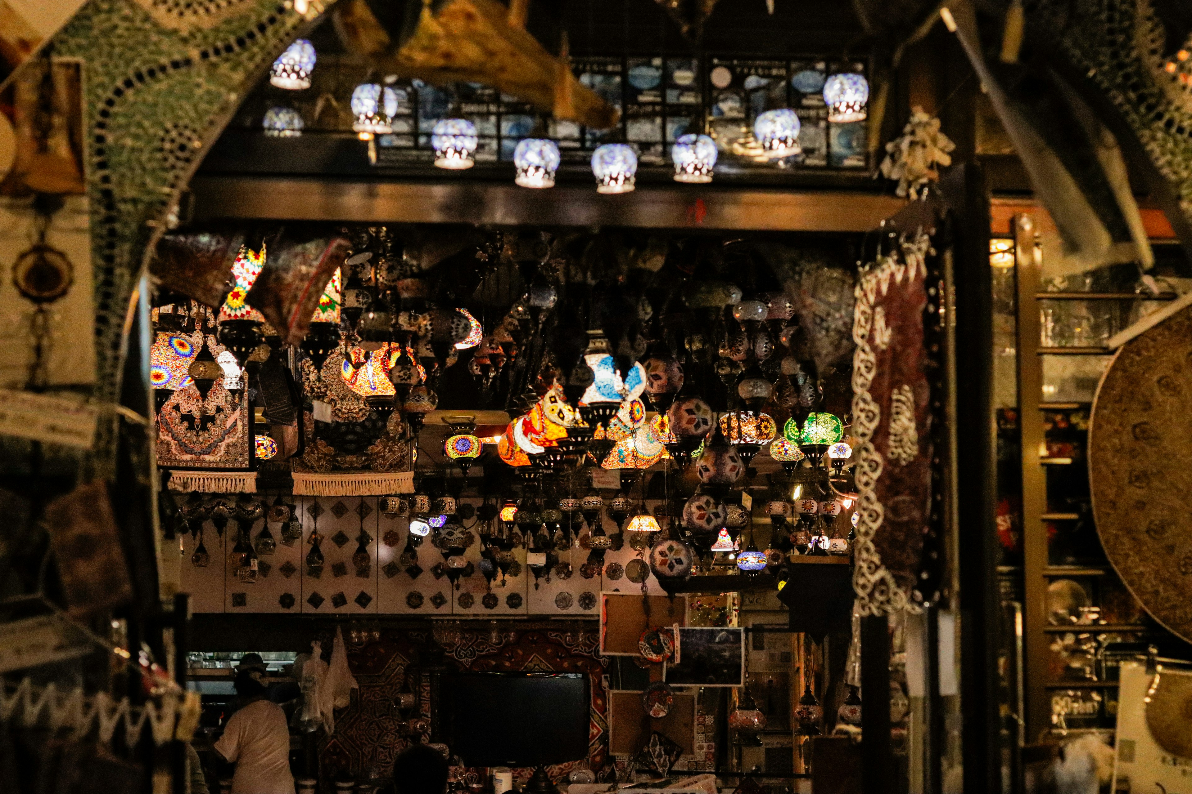 Interior of a market filled with colorful lamps and decorative items