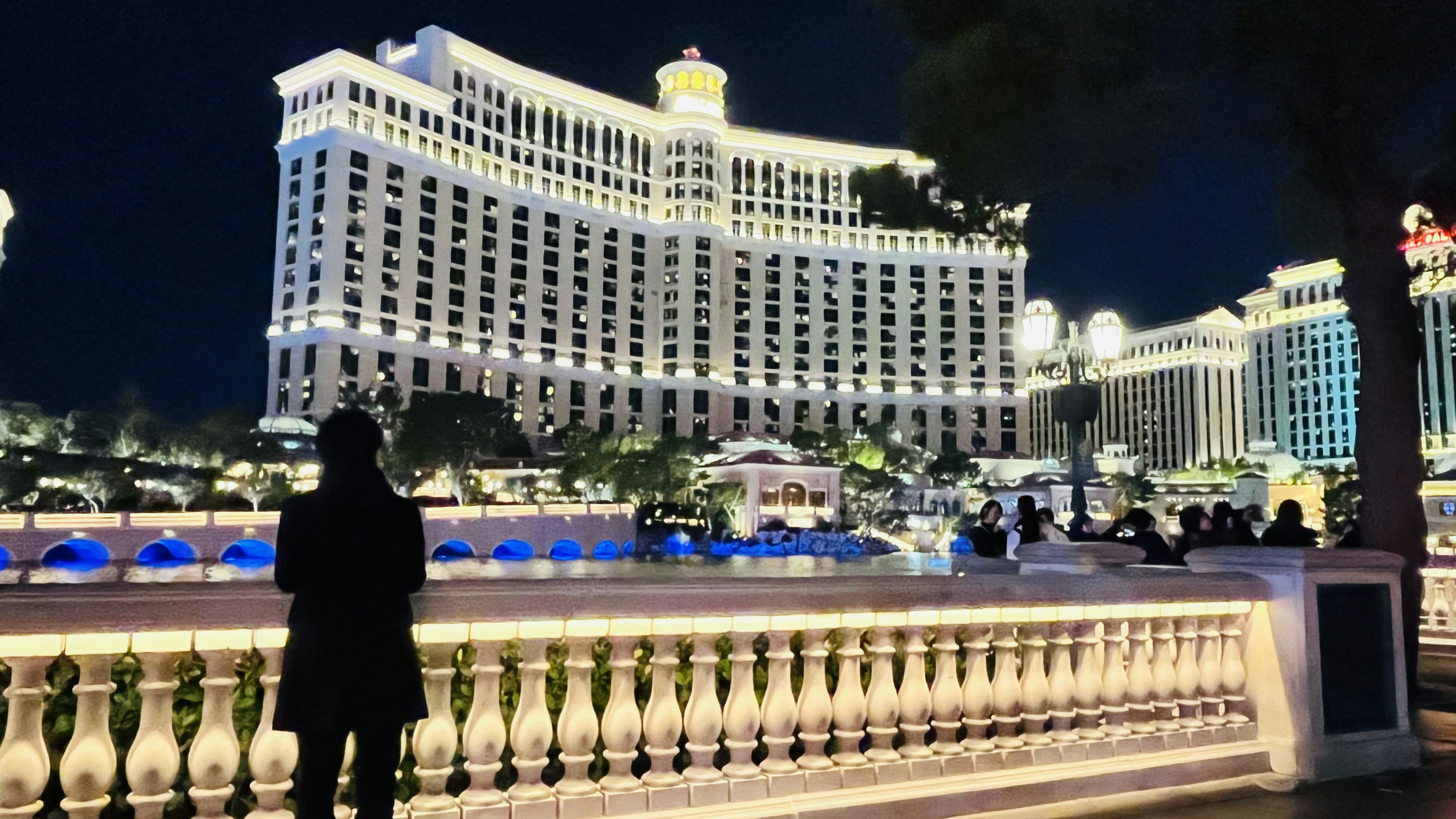 Beautifully lit Bellagio Hotel at night with fountain view