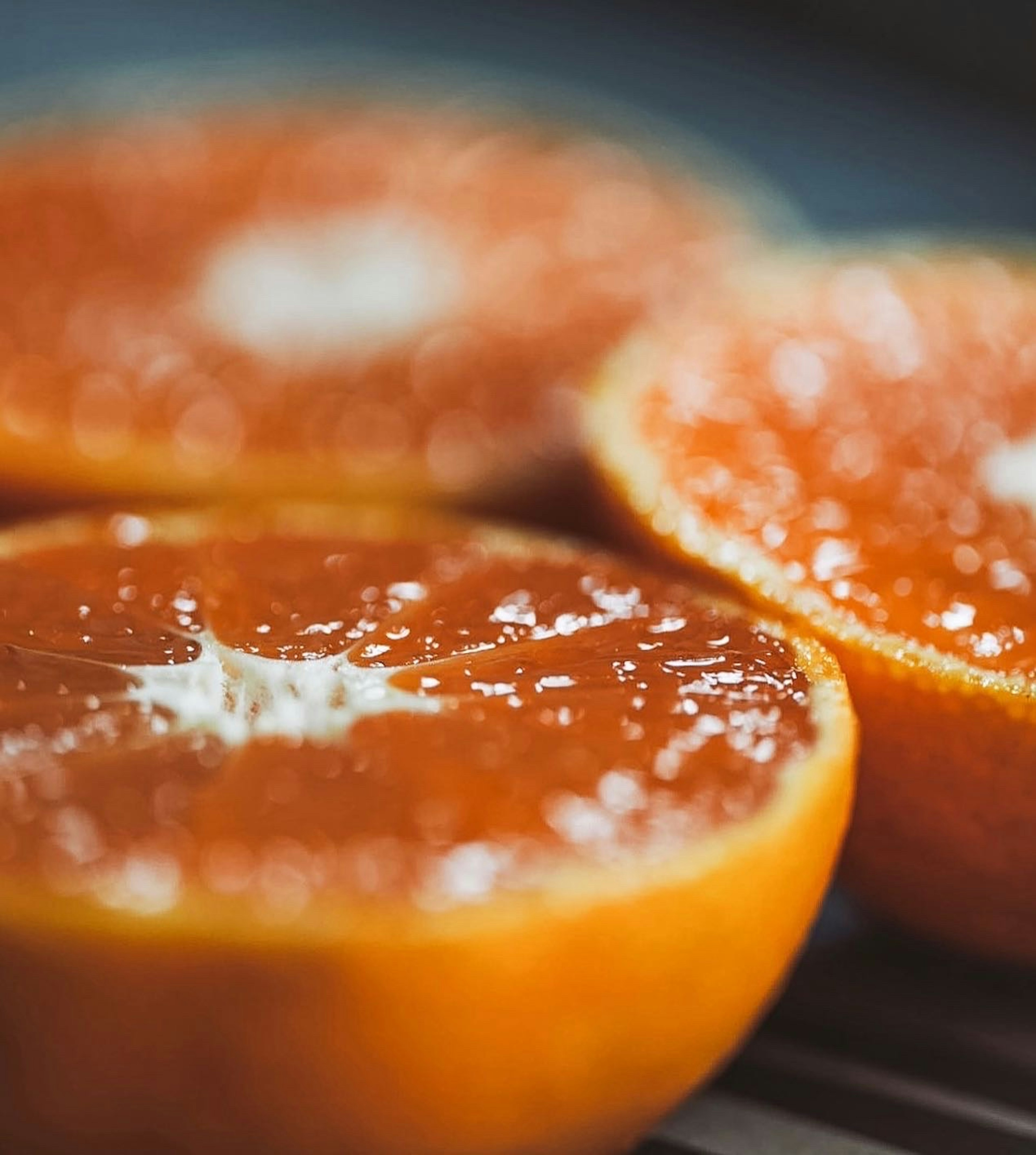 Close-up of vibrant orange slices with juicy texture