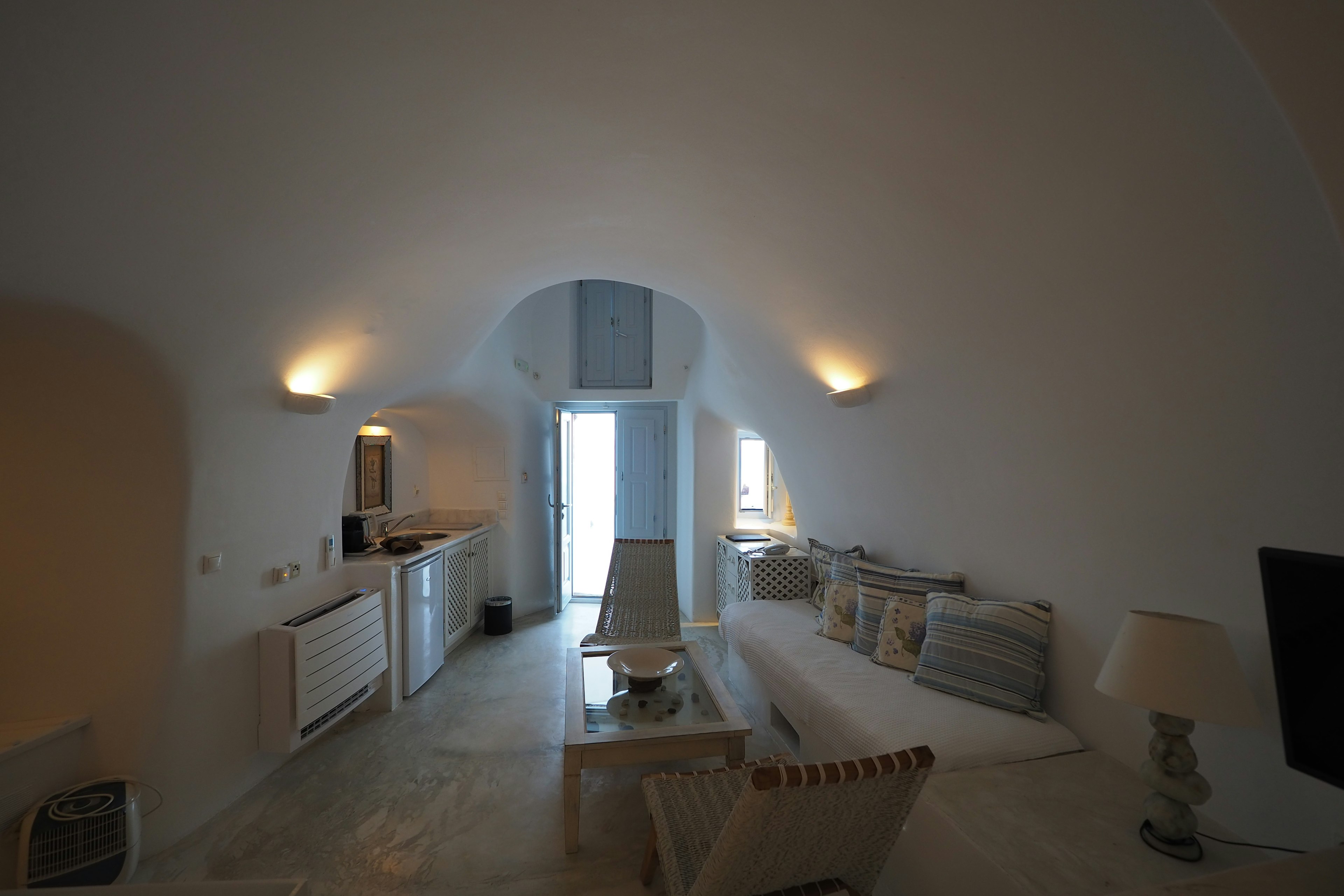 Interior of a modern living room with white walls and an arched ceiling