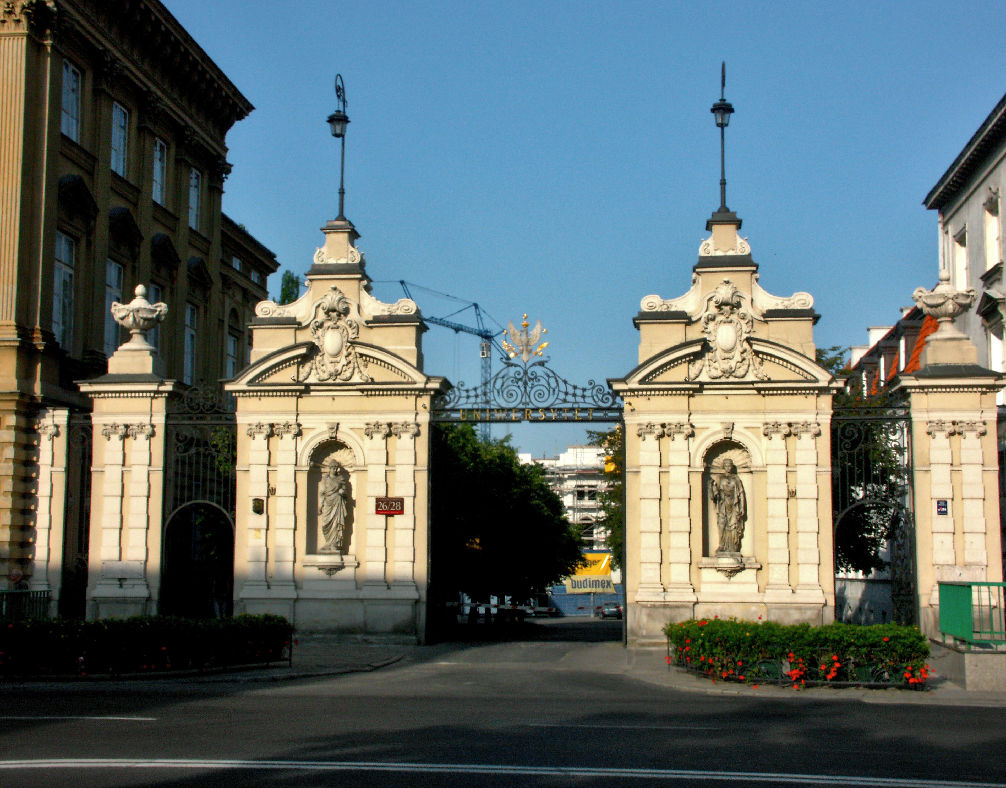 Elegant stone gate with intricate sculptures and figures