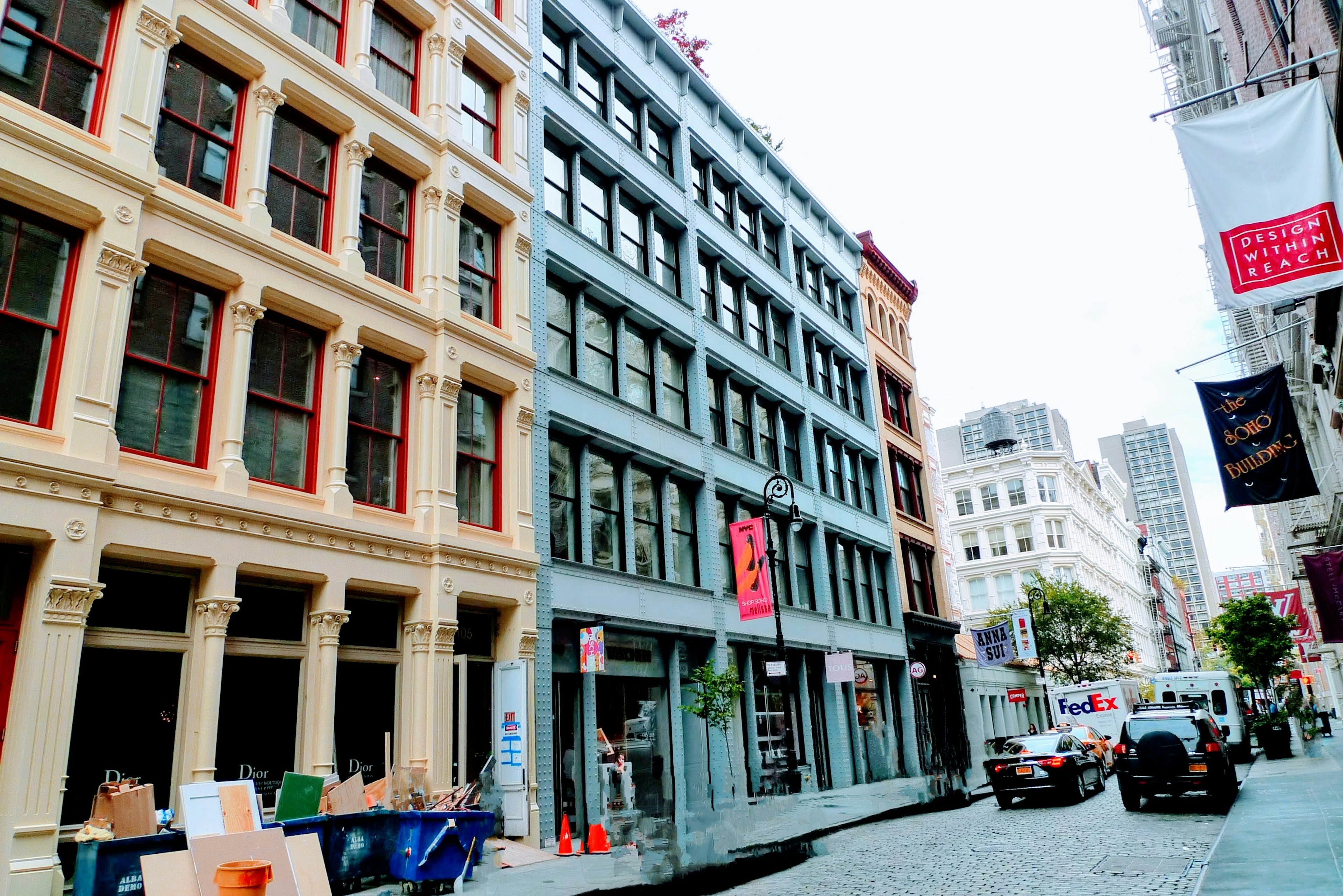 A street scene featuring a mix of historic and modern buildings