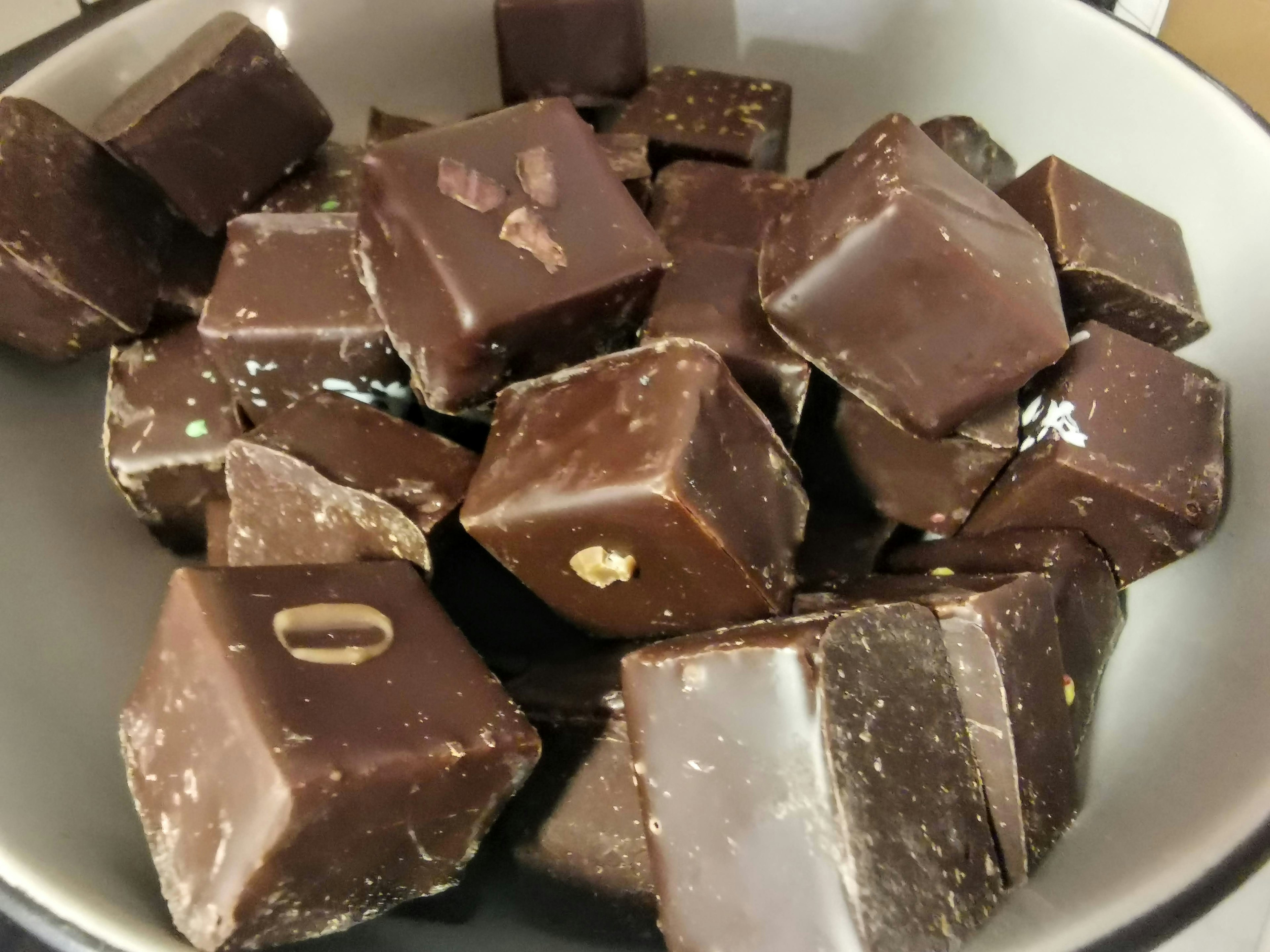 Brown chocolate cubes piled in a bowl