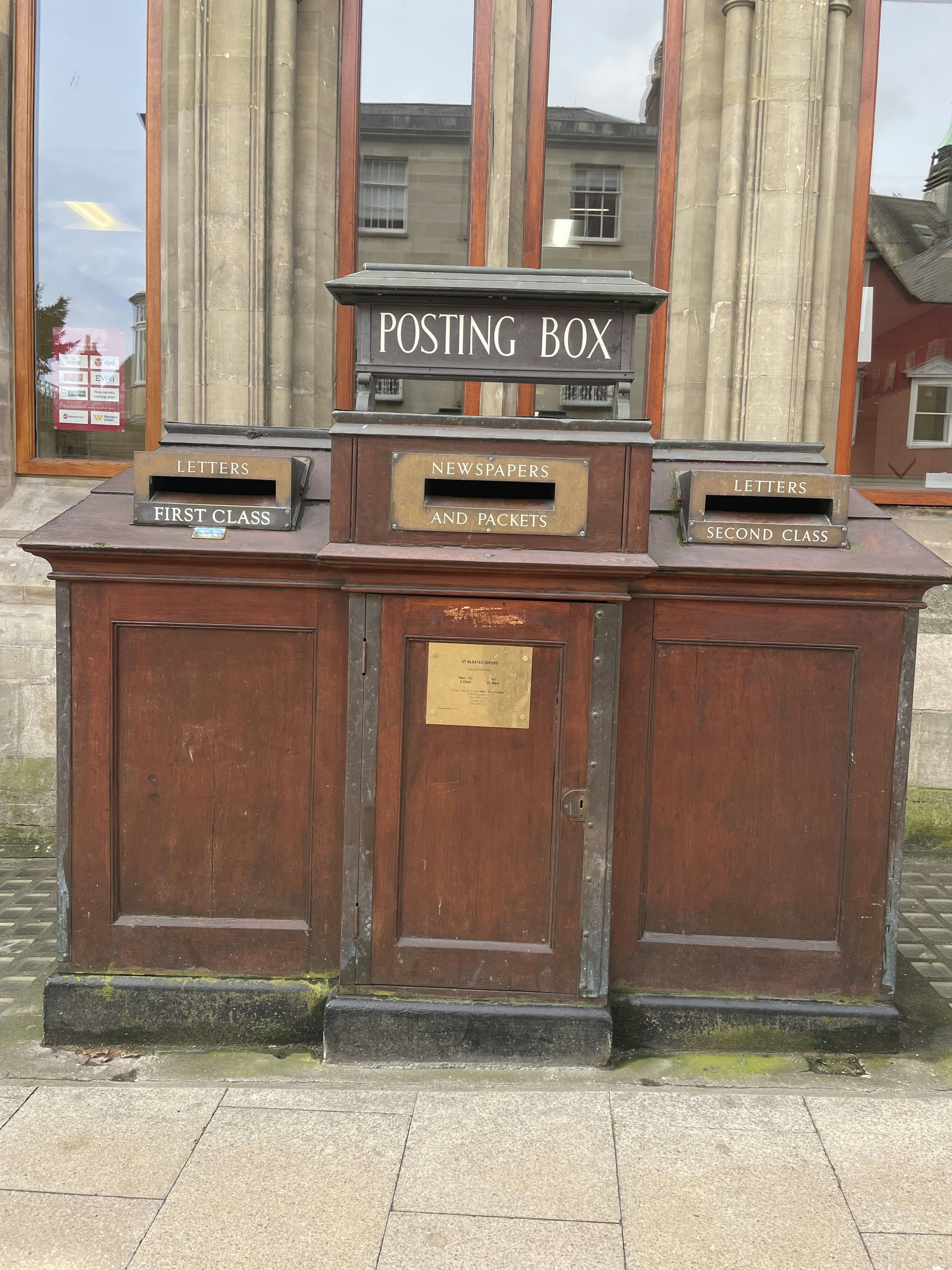 Three vintage wooden posting boxes arranged side by side