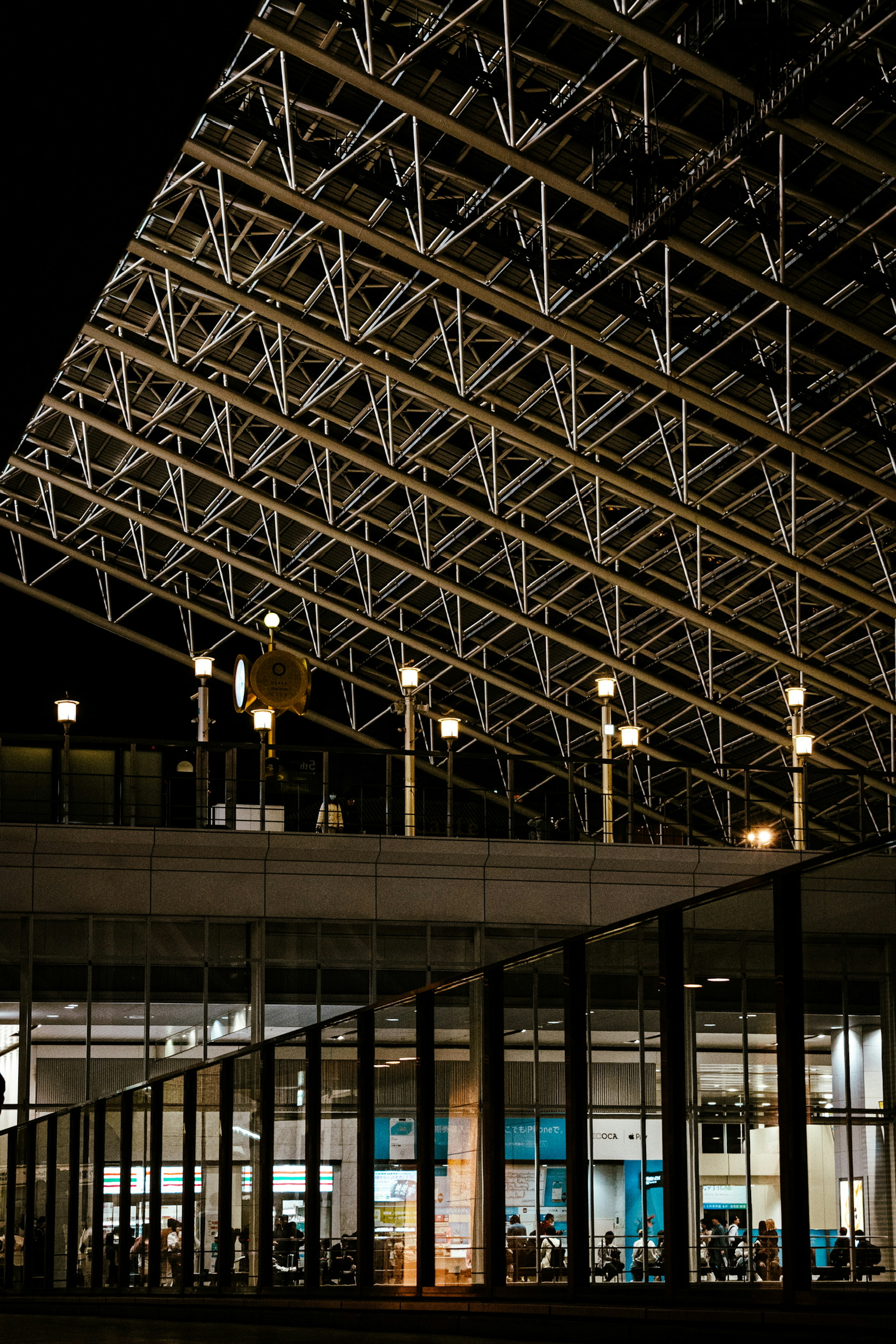 Modern airport terminal architecture with unique lighting at night