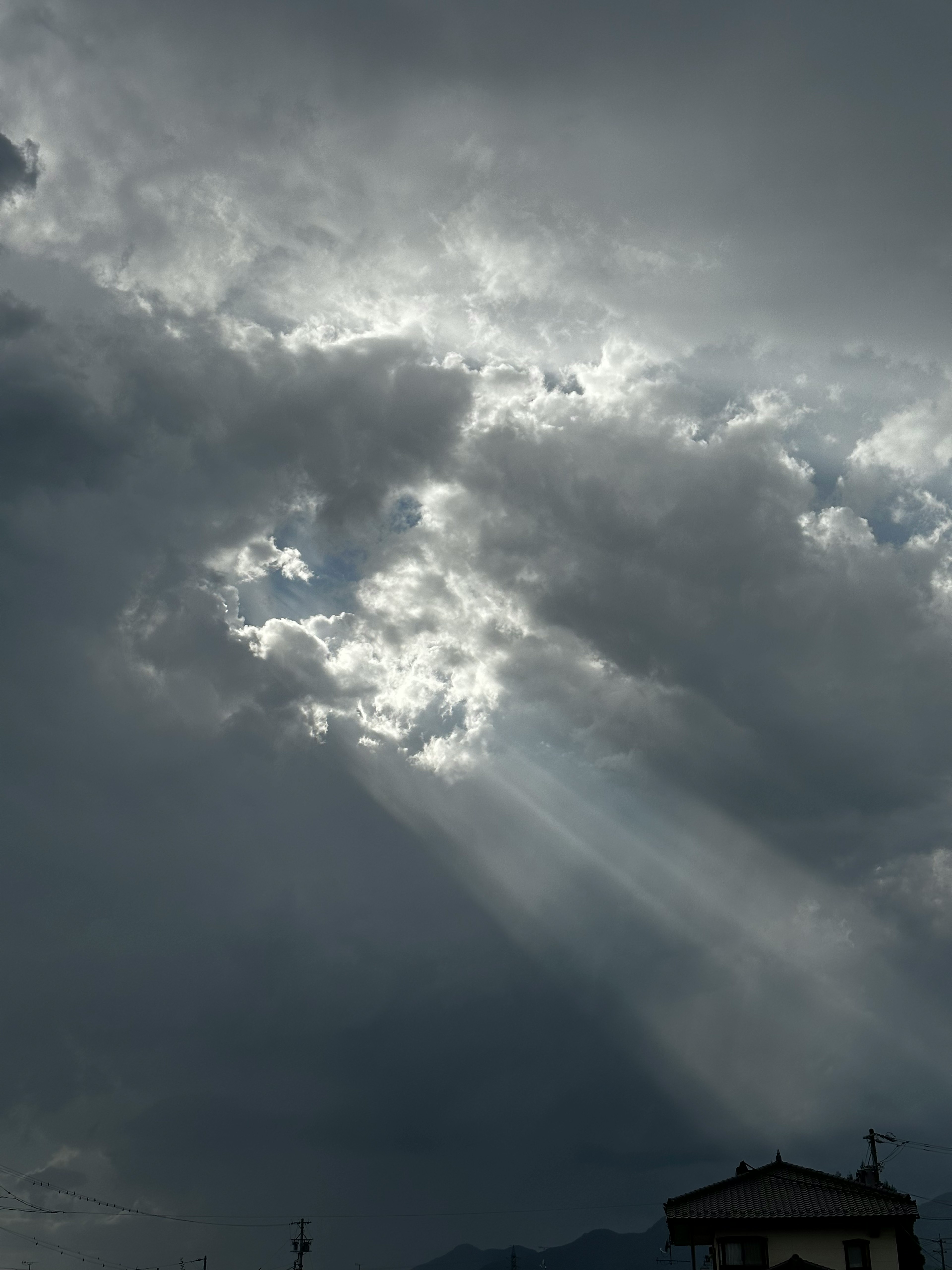 Light streaming through dark clouds with a dramatic sky