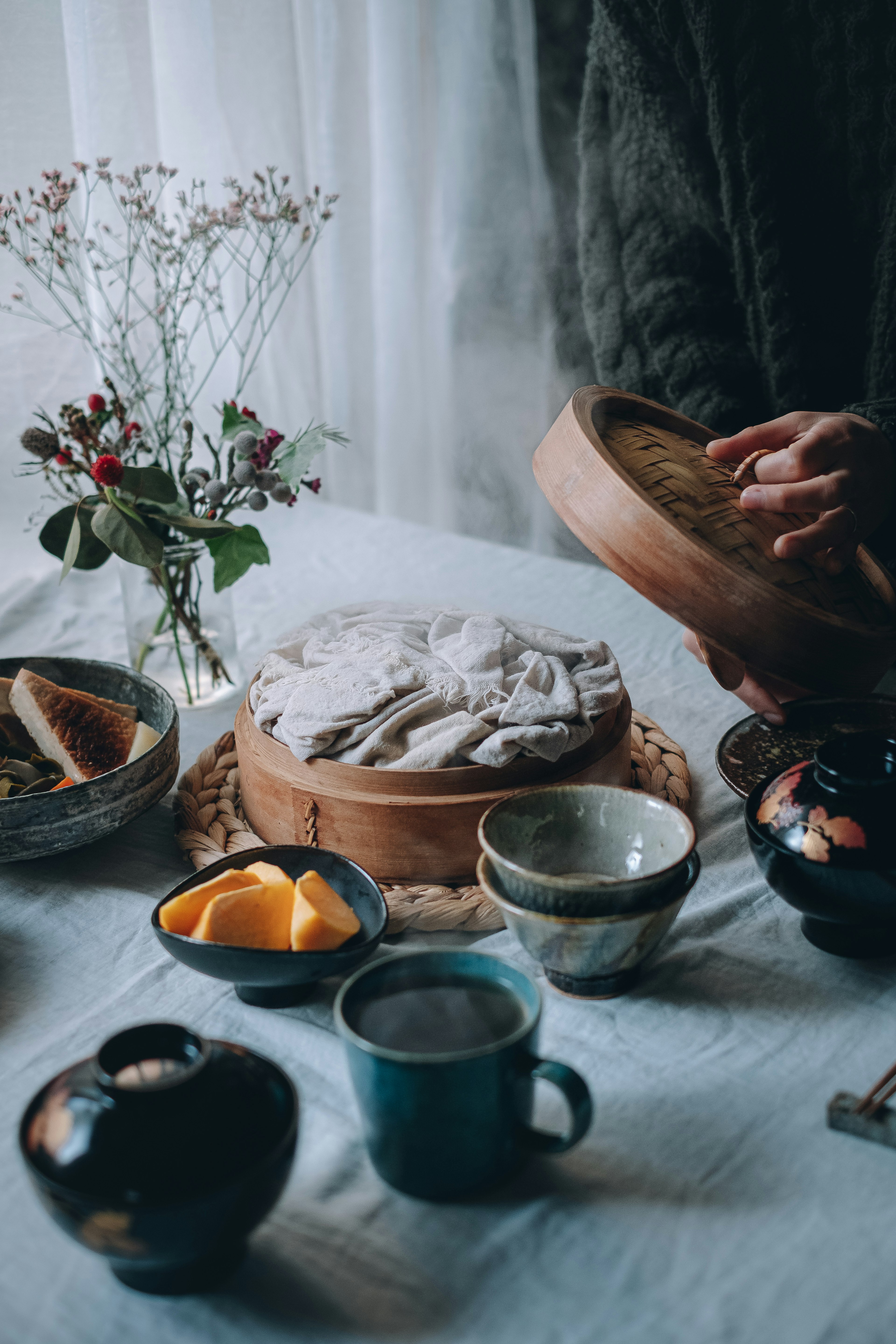 A serene table setting featuring a cake and beverages