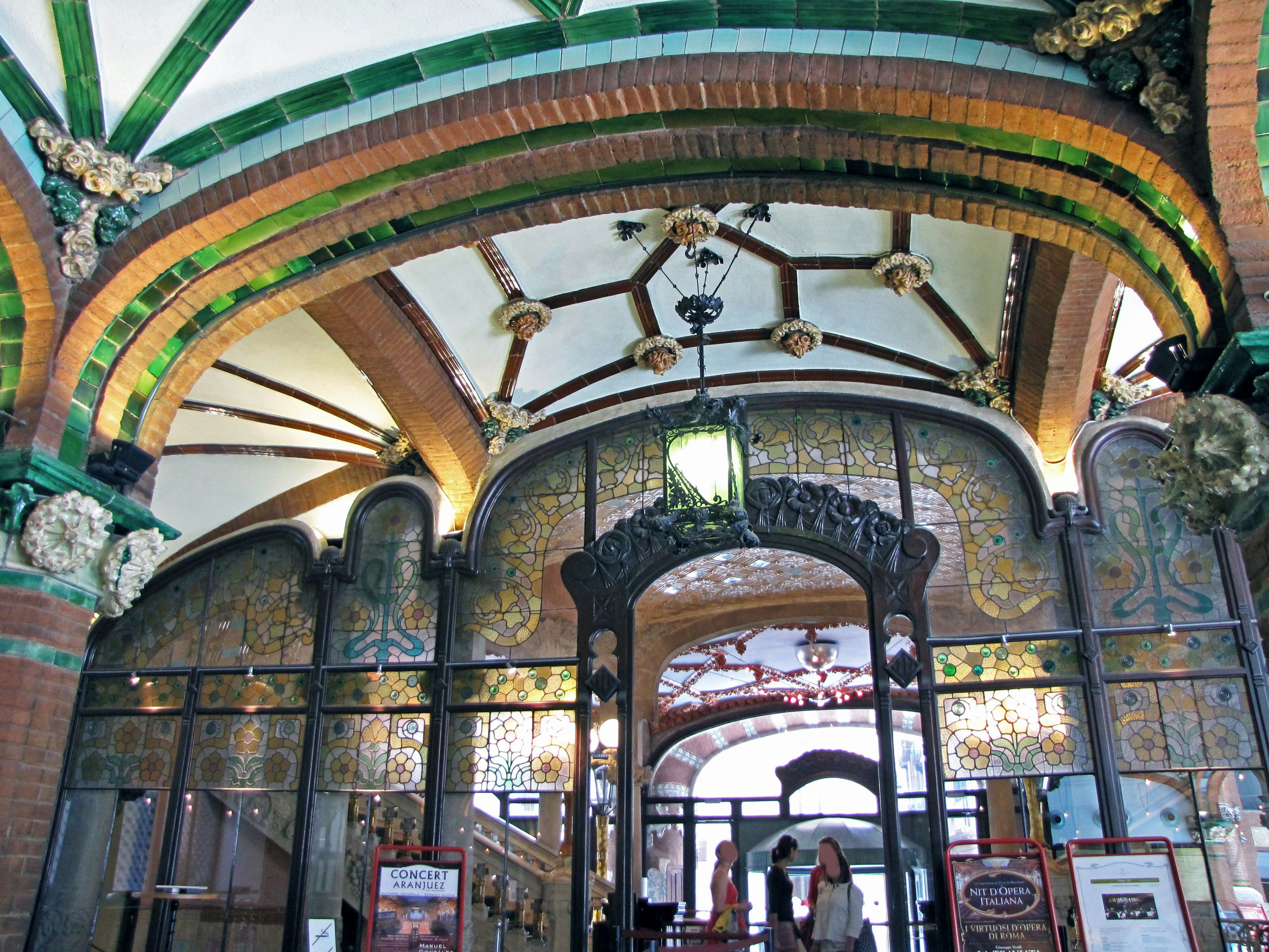 Historic building entrance with beautiful decorations and arched ceiling