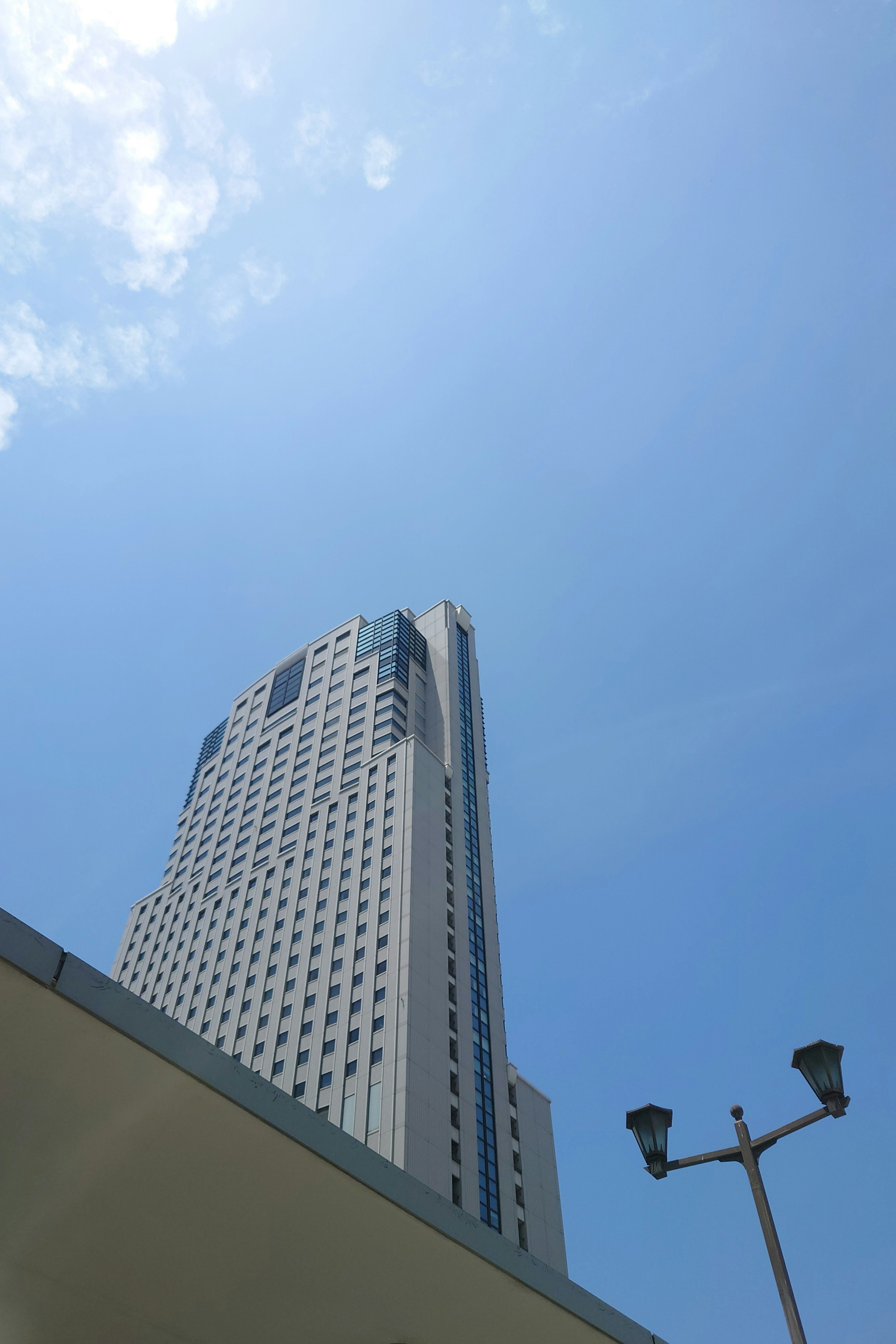 Tall building rising against a clear blue sky