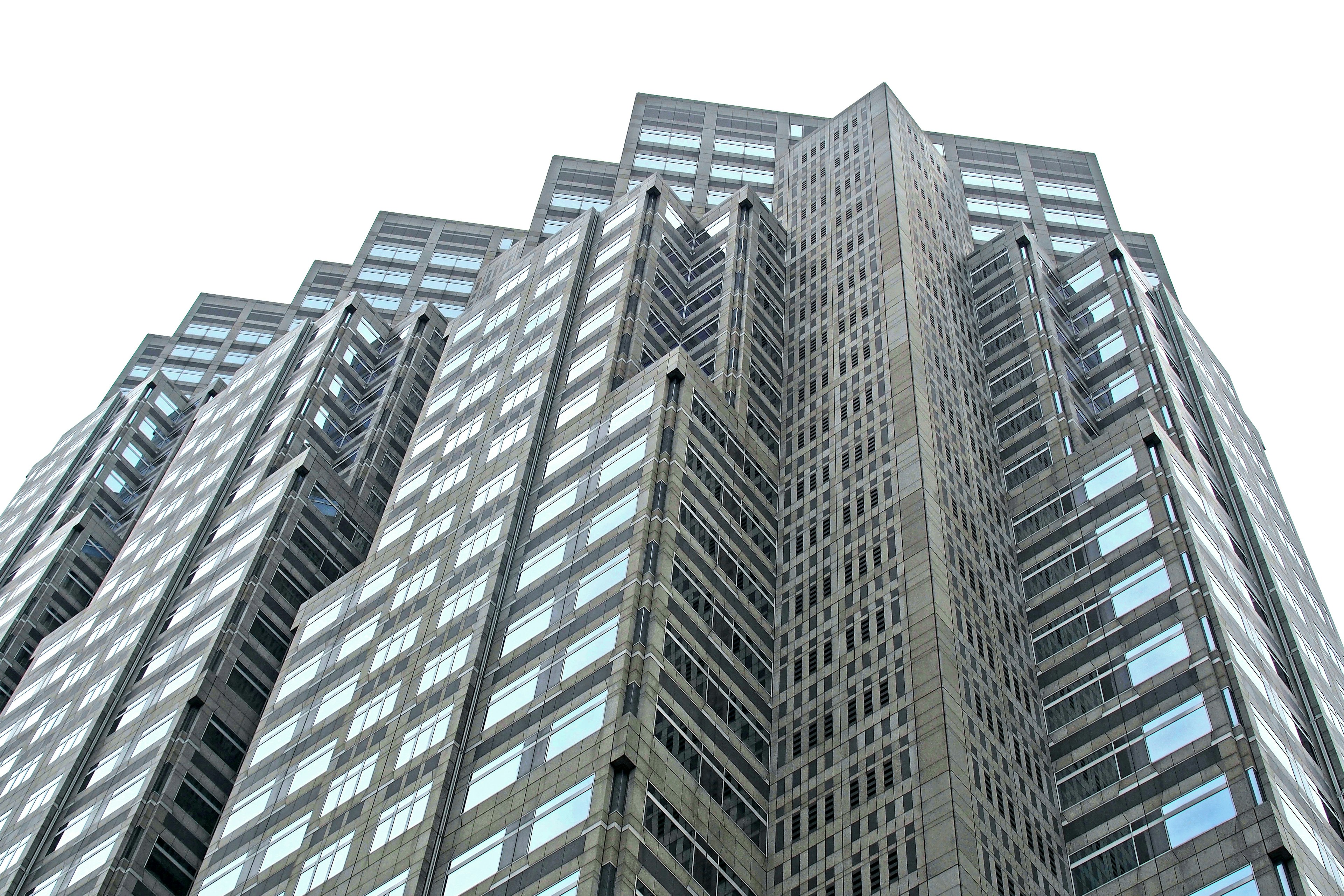 Close-up shot of a skyscraper with visible window reflections