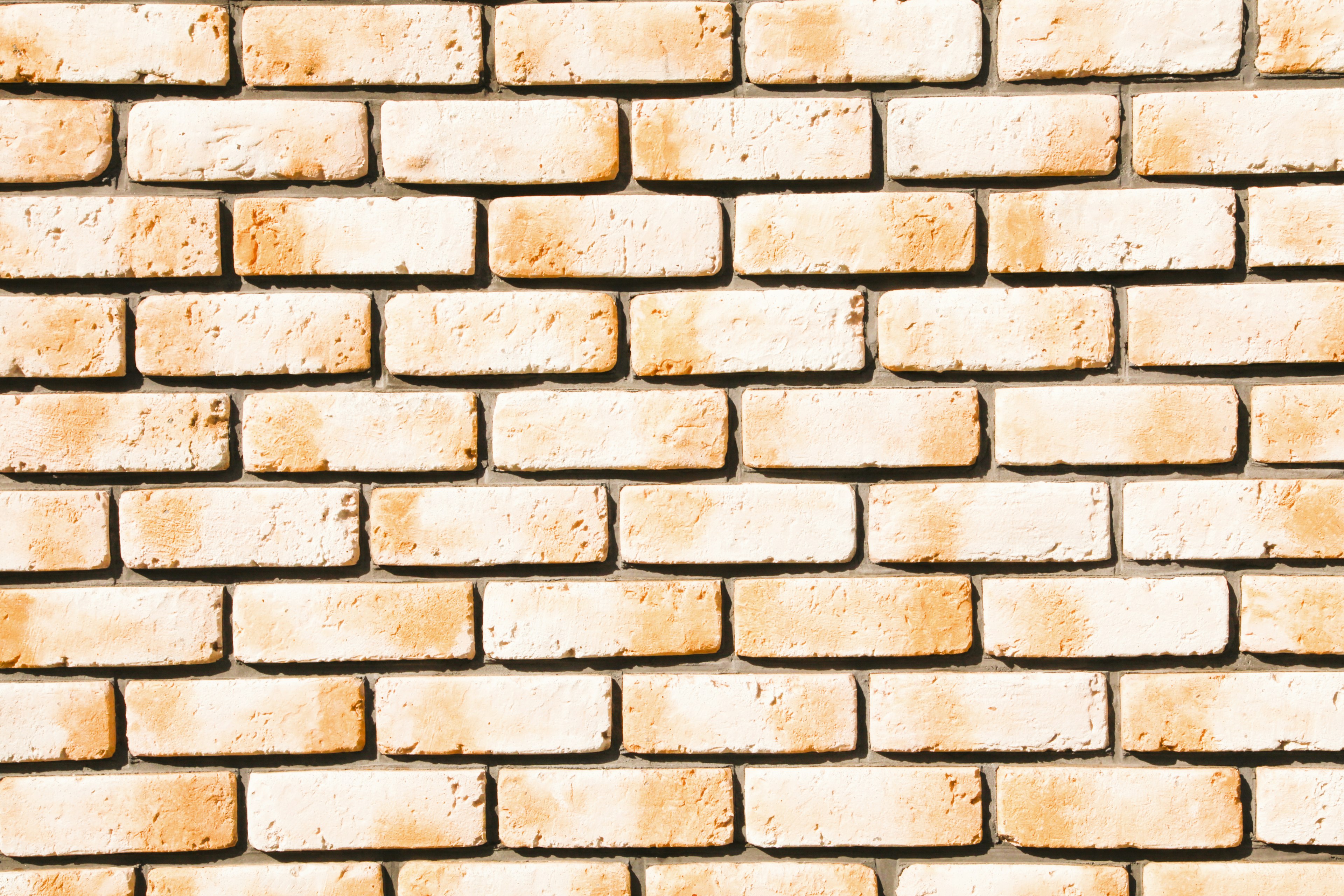 Textured pattern of a white brick wall