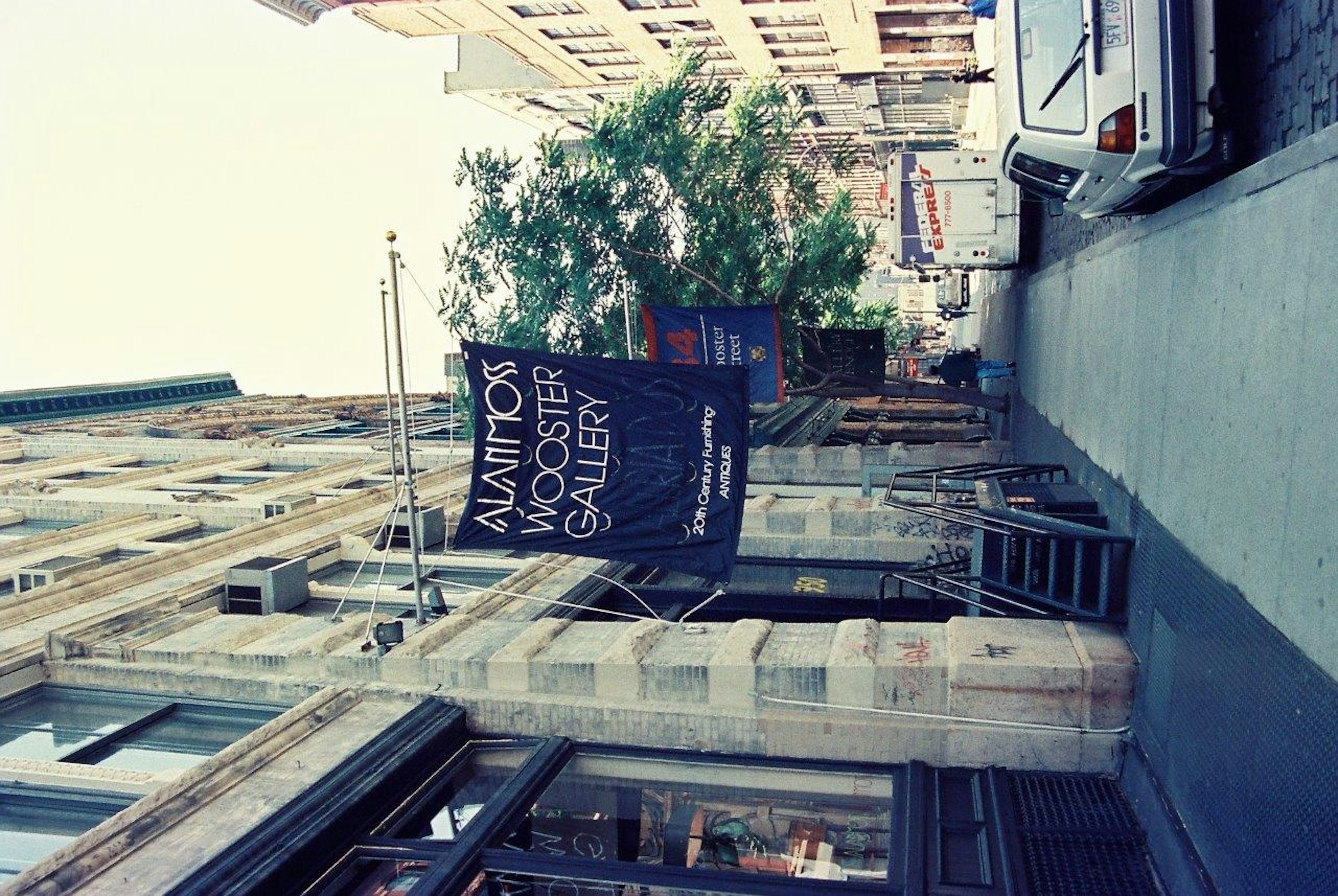 Street view featuring a sign for the Monster Gallery