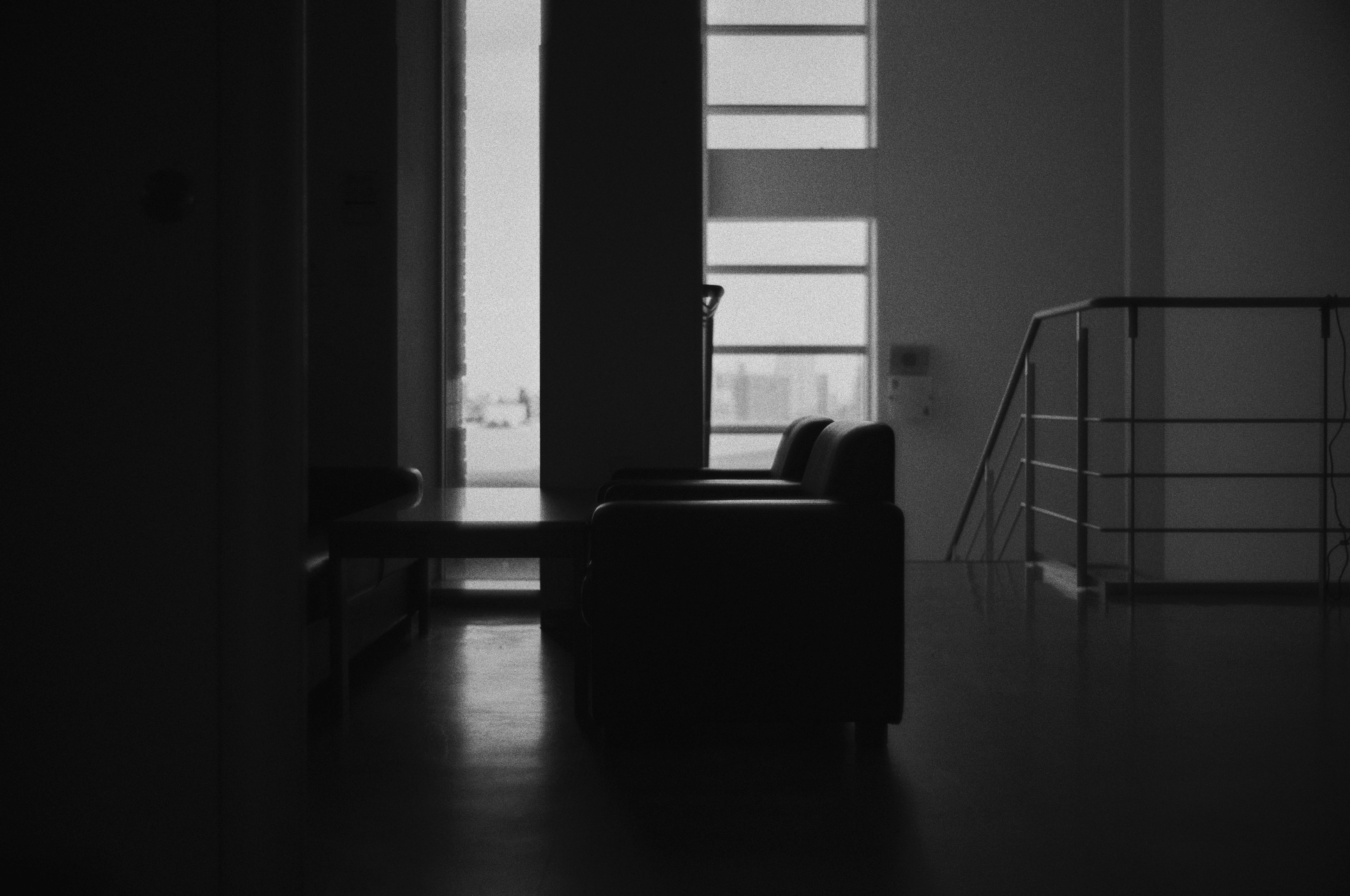 Silhouette of a sofa and window in a dark interior