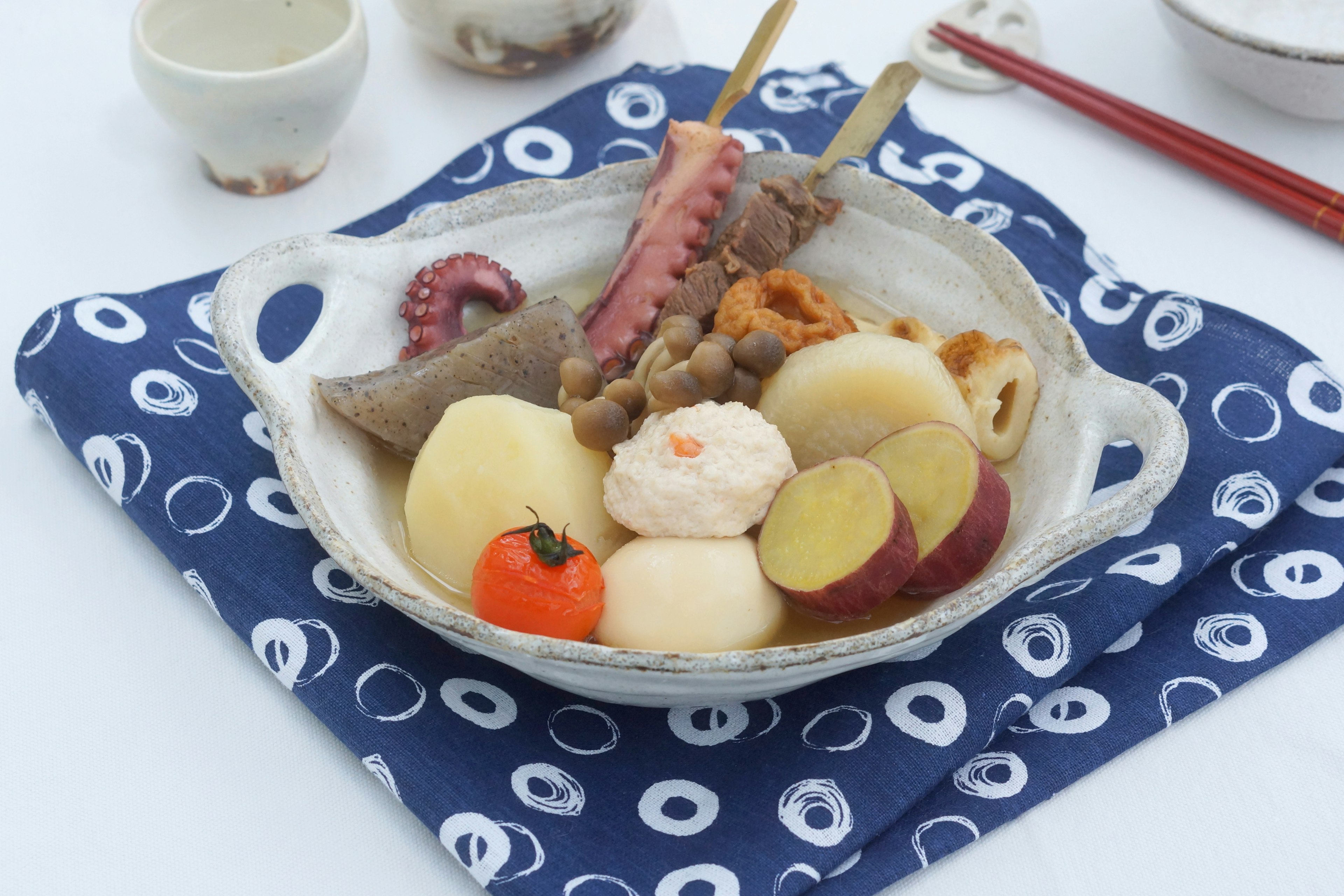 A plate of Japanese oden featuring various colorful ingredients