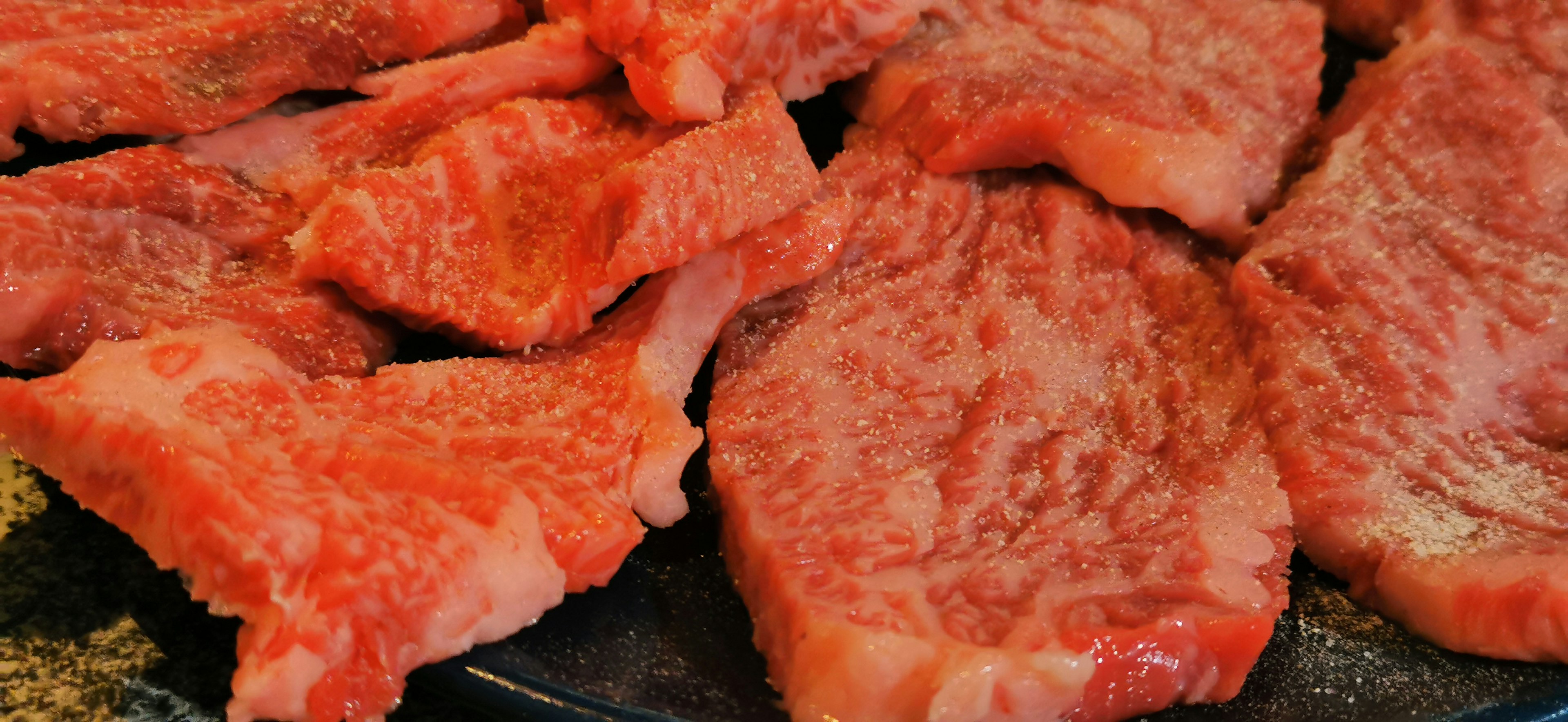 Image of marbled beef slices ready for grilling