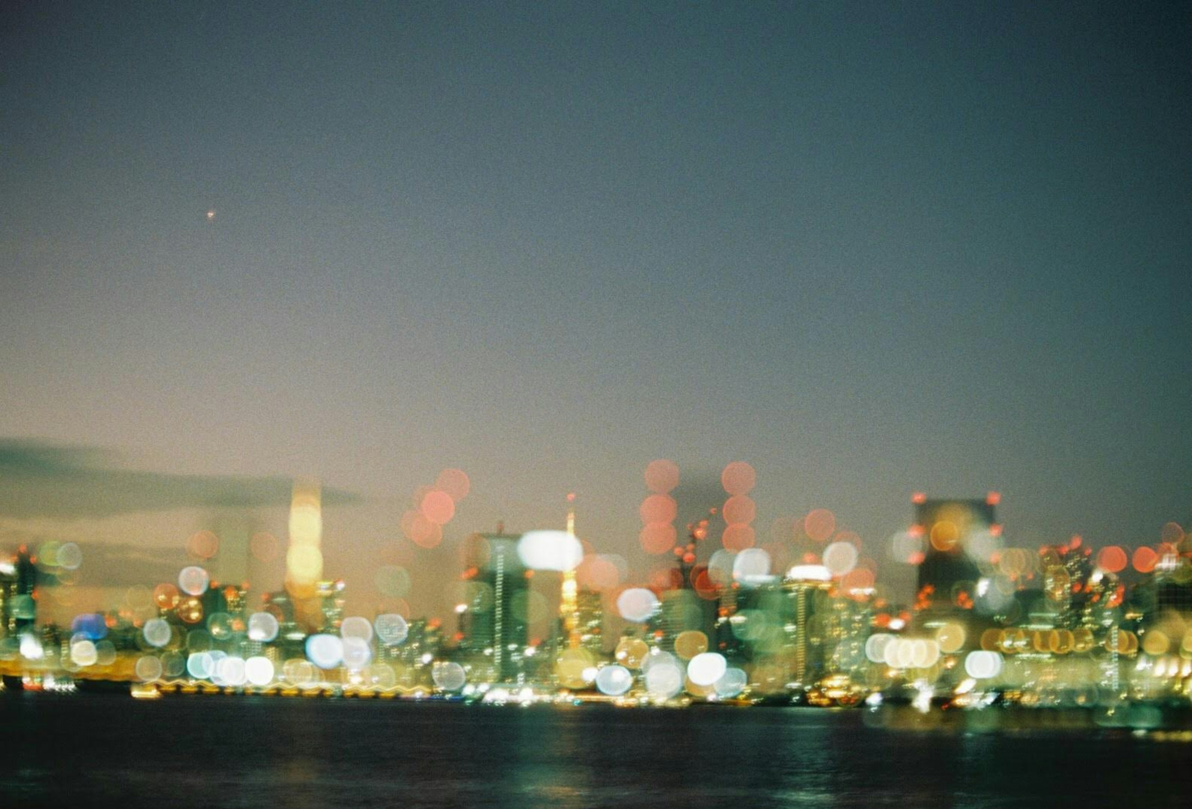 Blurry night cityscape with vibrant lights