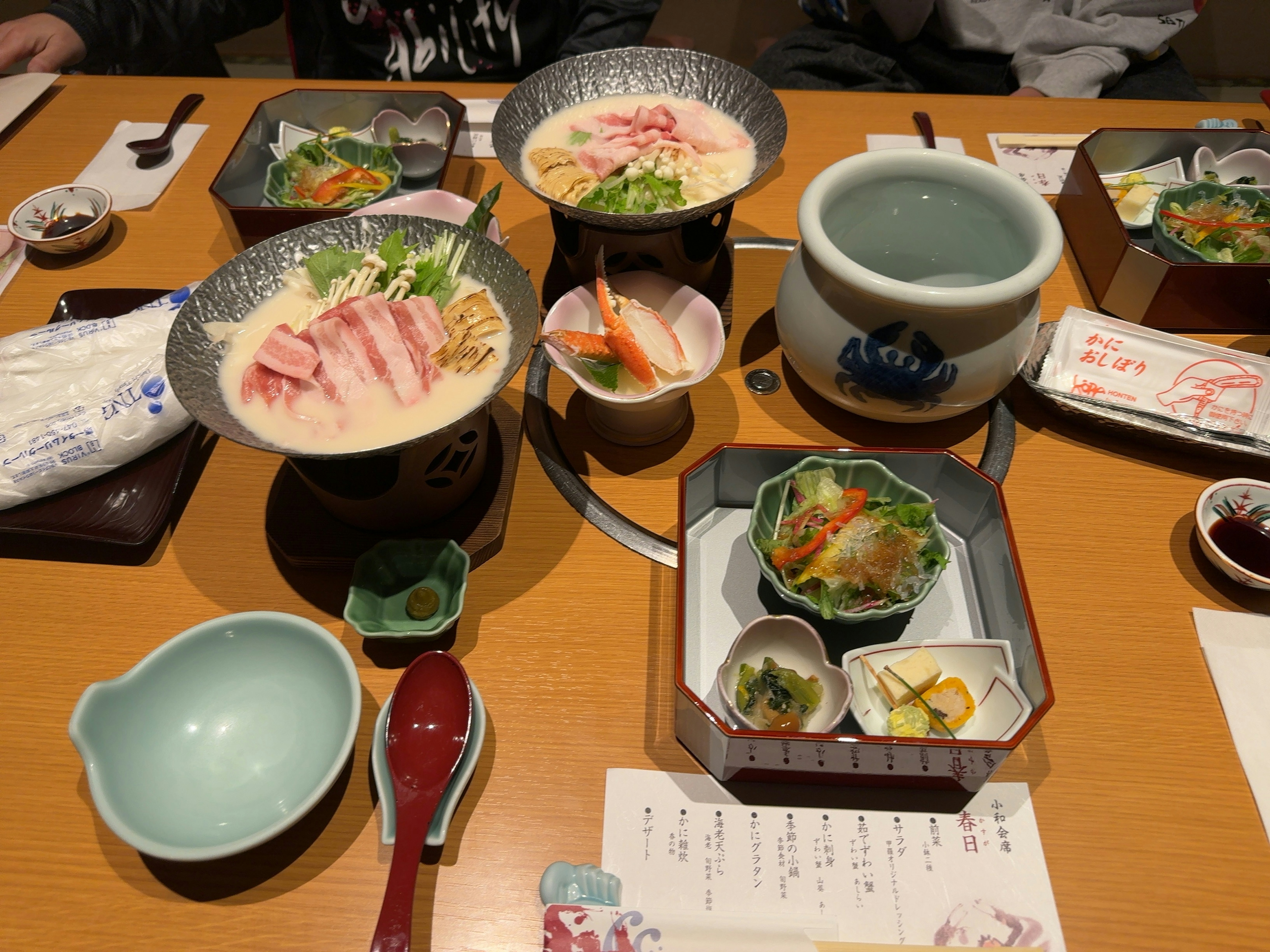 Japanese cuisine served on a wooden table with various dishes